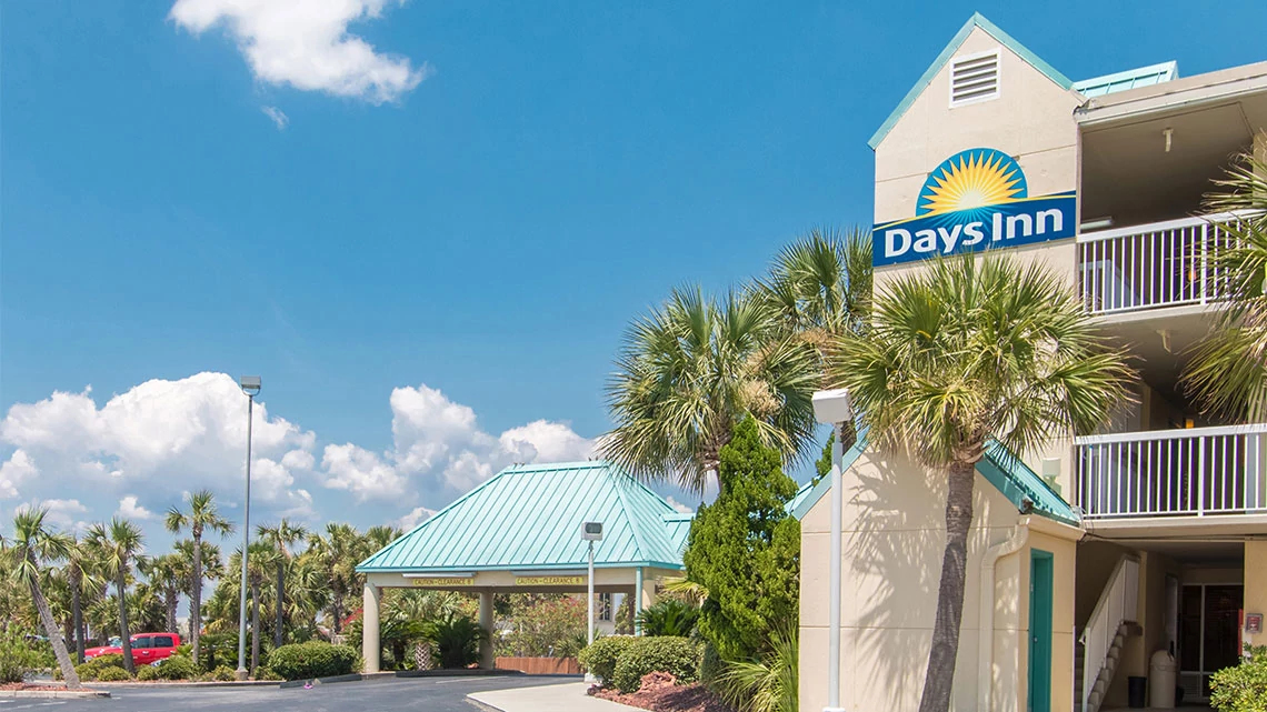 Days Inn® by Wyndham Side view of the Days Inn hotel property