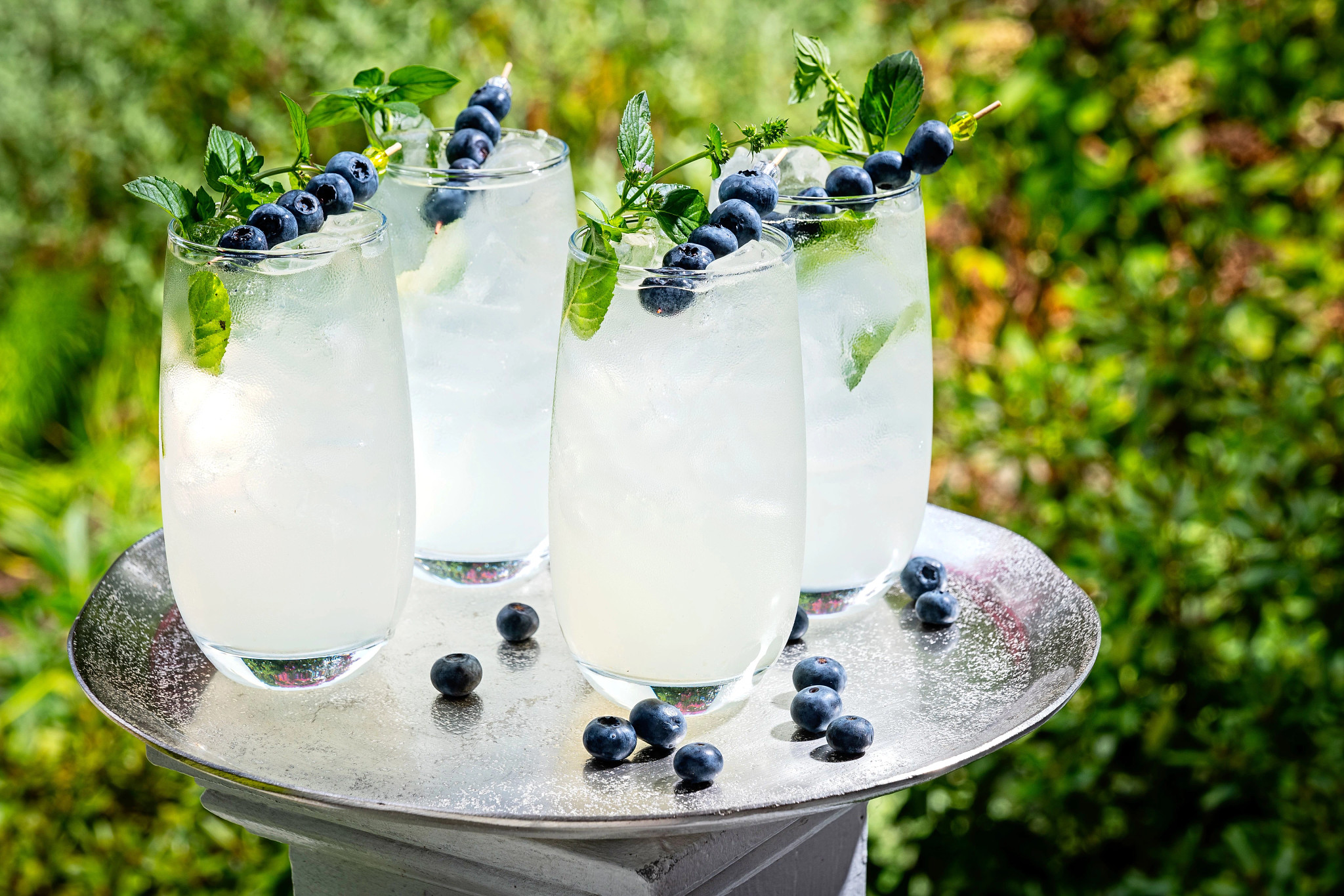 4 glasses of Blueberry Vodka on a tray table
