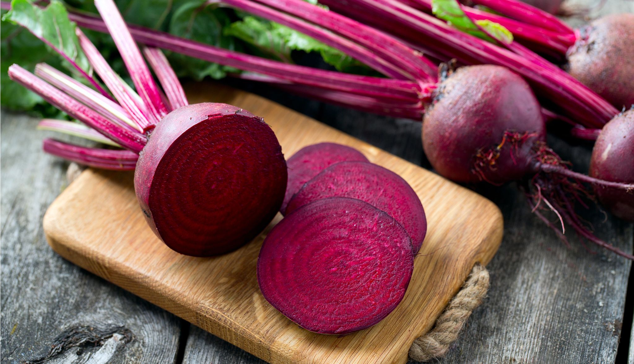 Healthy Fall Foods fresh sliced beetroot on wooden surface
