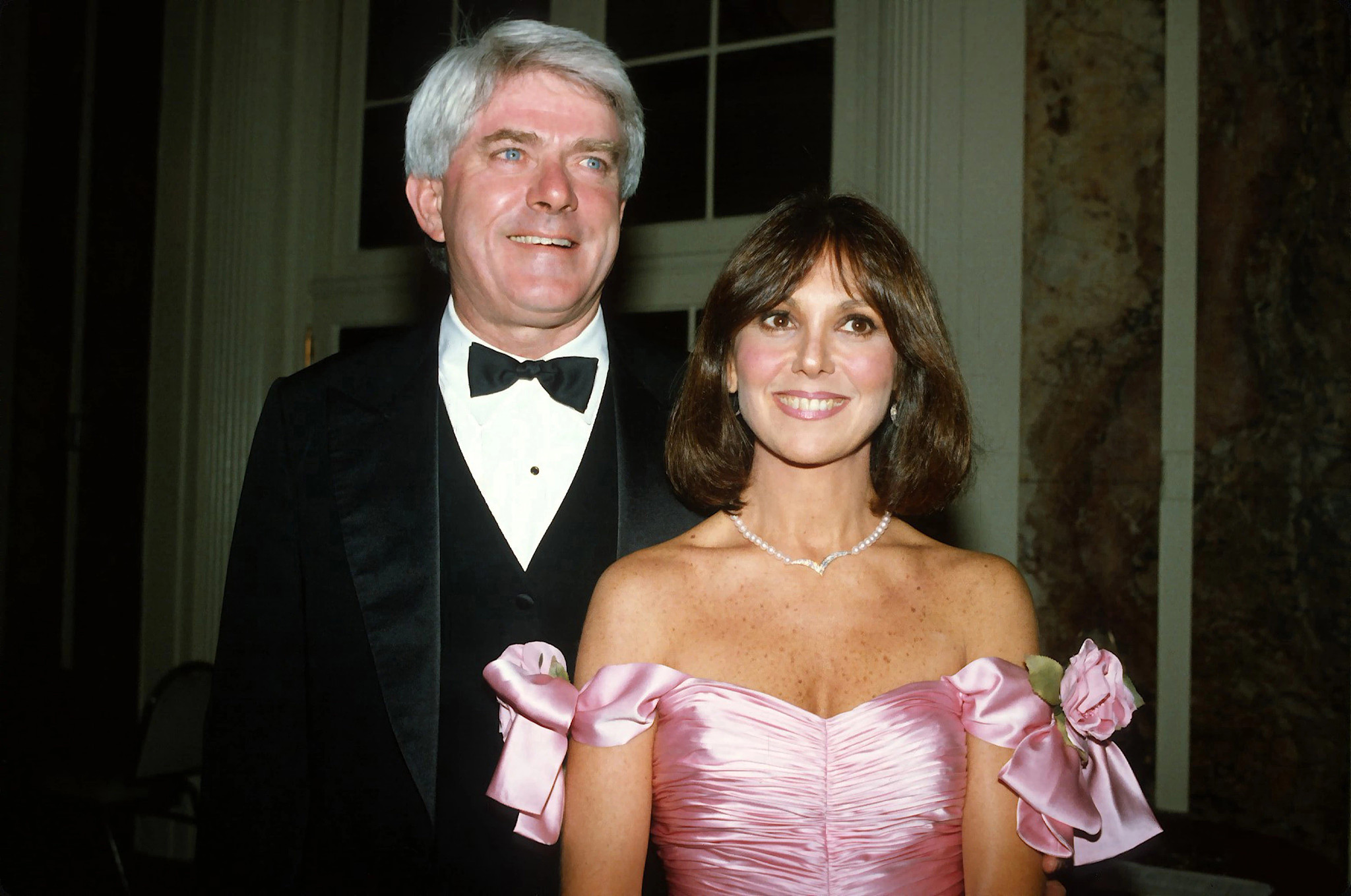 Phil Donahue and his wife Marlo Thomas standing together while attending Gloria Steinem's birthday party in New York City