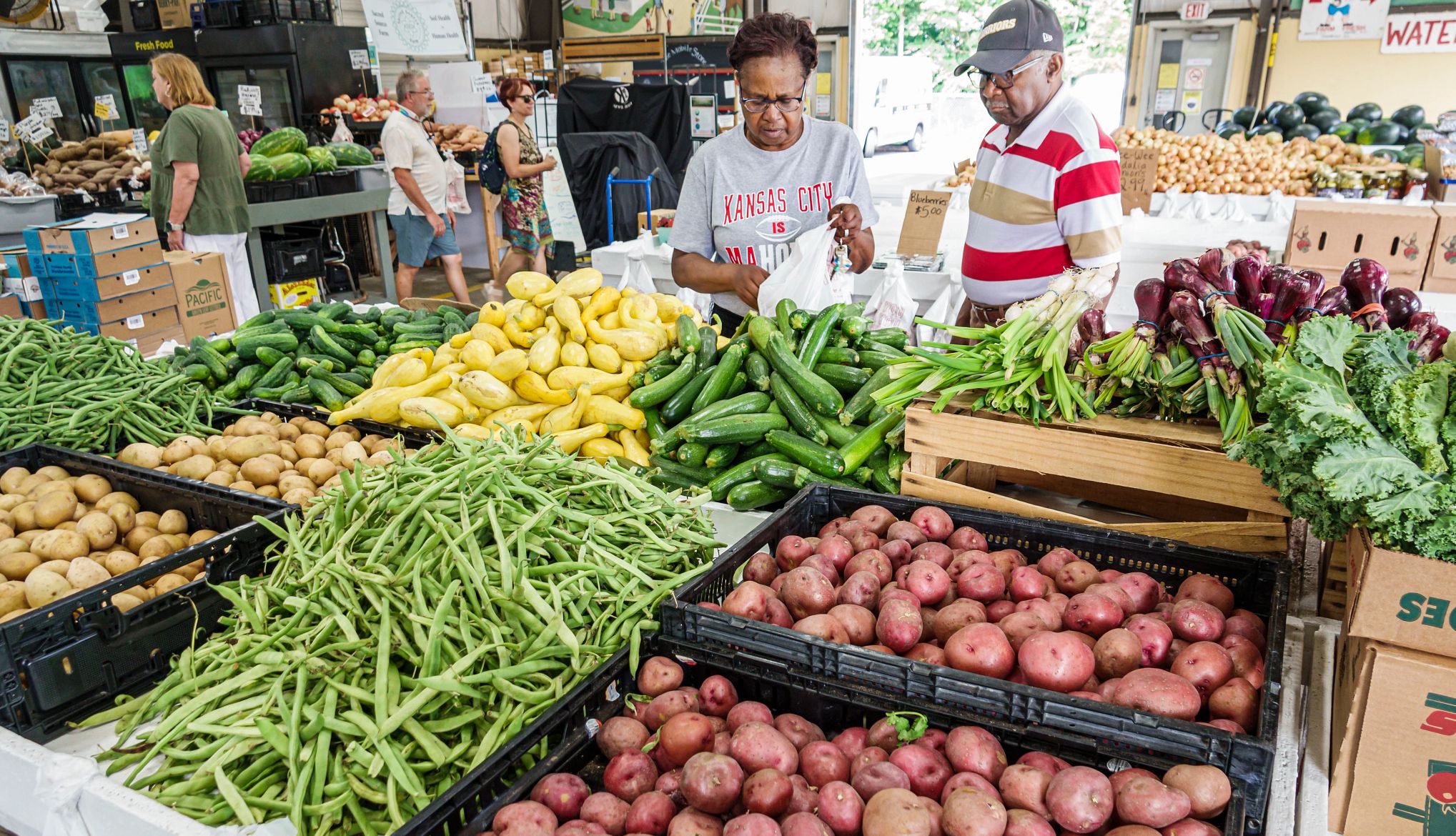 SNAP, Medicaid Changes Timeline red potatoes, green beans and yellow squash at a farmers market