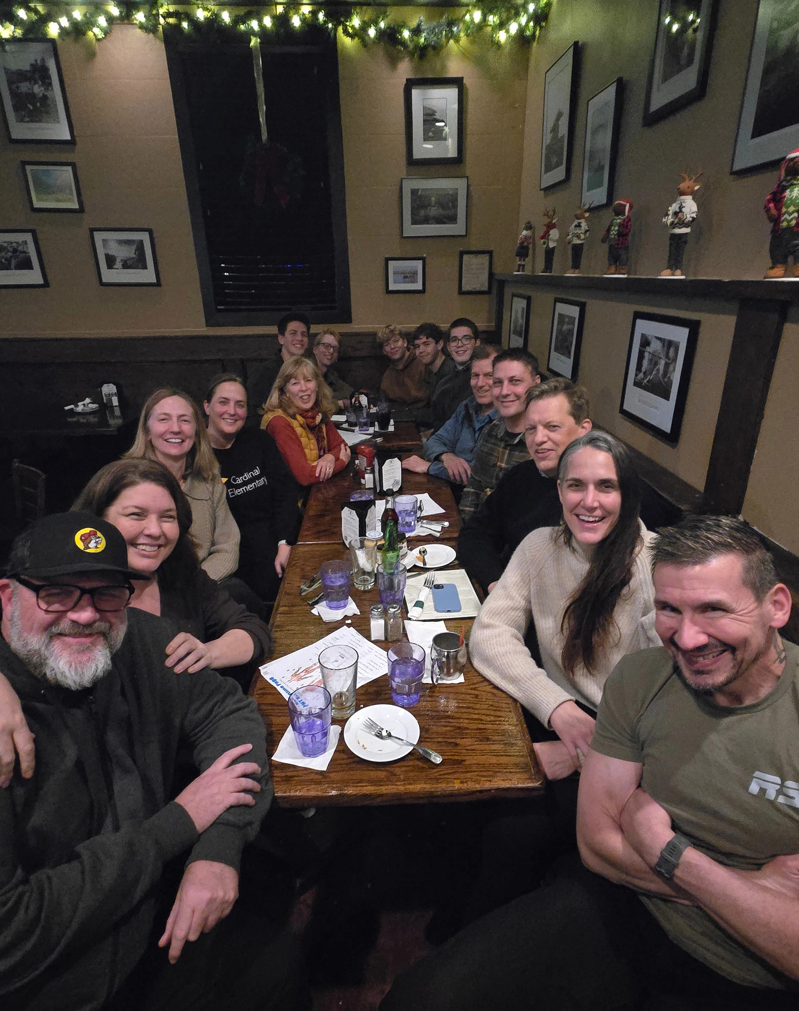 A photo shows writer Kim O'Connell and friends at a recent trivia night, joined by some of their college-aged kids