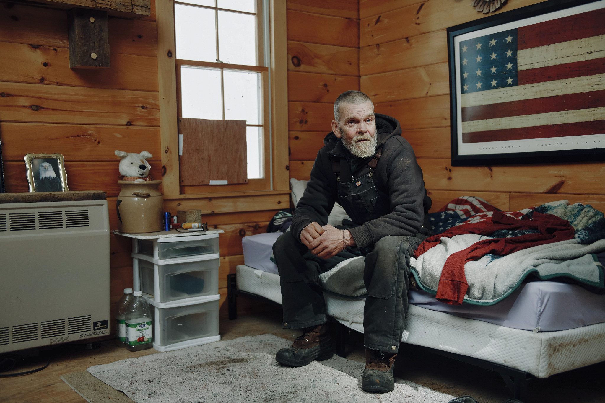 a man sitting on a bed