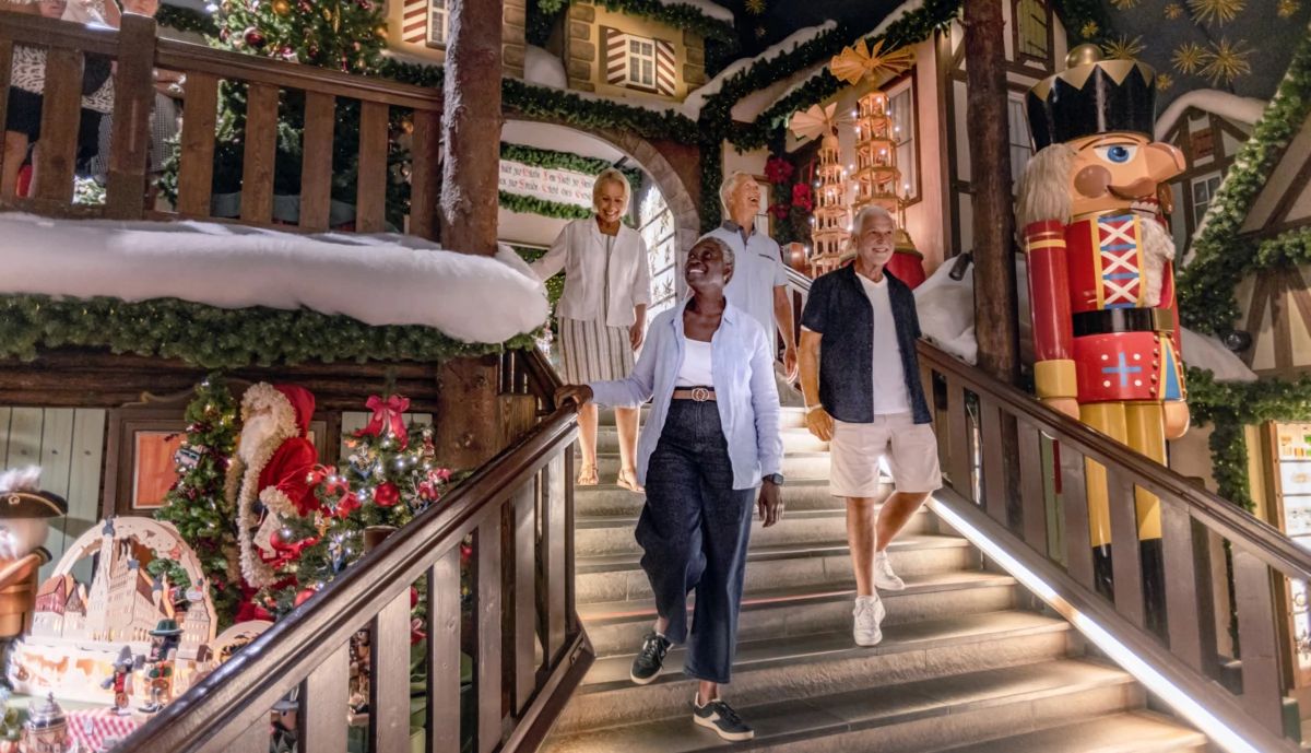 Christmas Cruise people walking down steps surronded by Christmas decorations