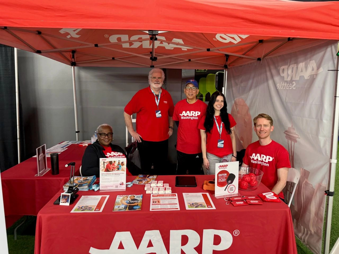 people working at a booth