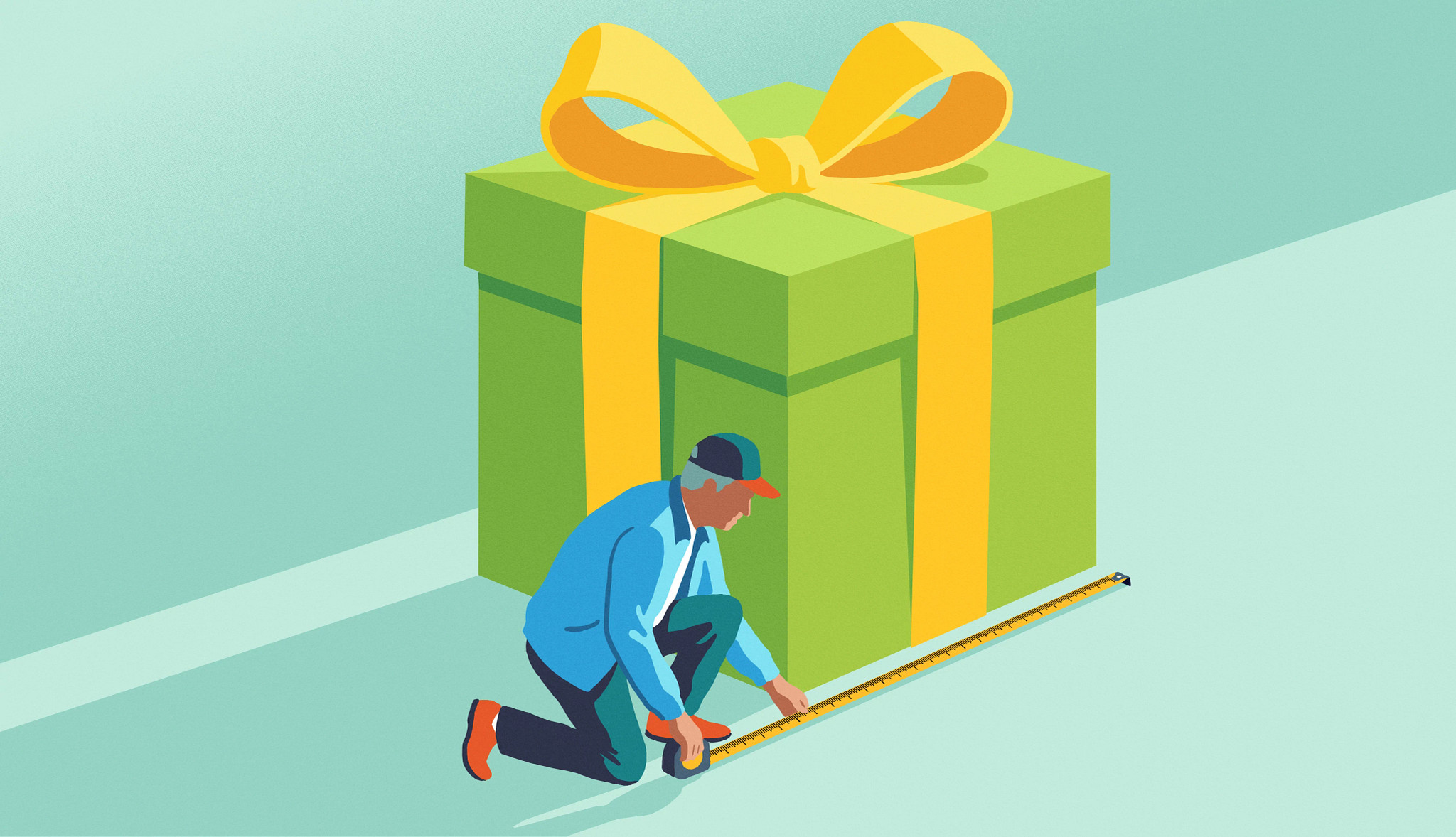 a man uses a tape measure to measure a giant gift box