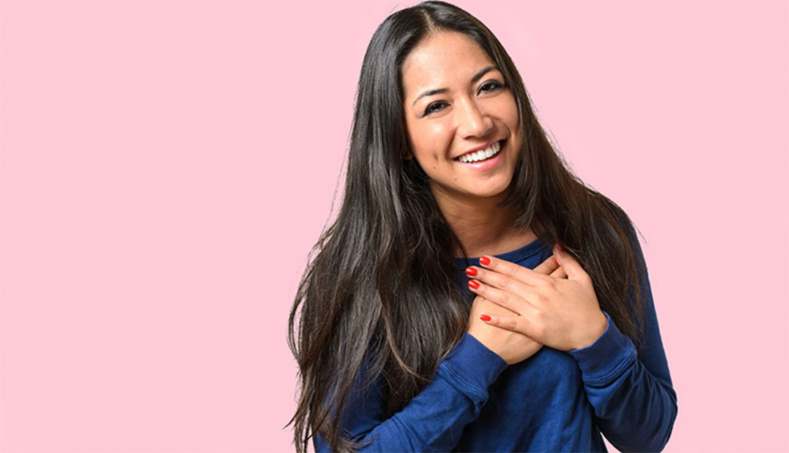 Practicing gratitude is associated with many positive effects in a person’s physical and mental health A woman with both hands on her chest over her heart
