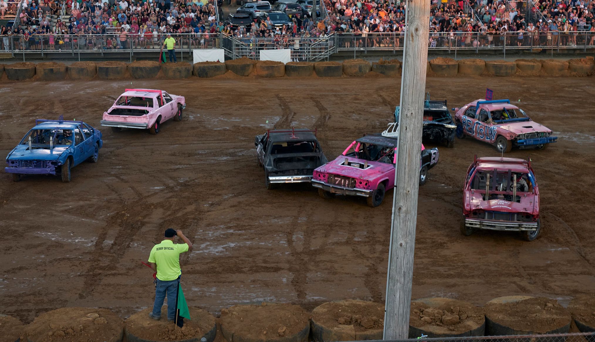 The Tennessee State Fair has motor sports each night pink and blue motor cars at the Tennessee State Fair