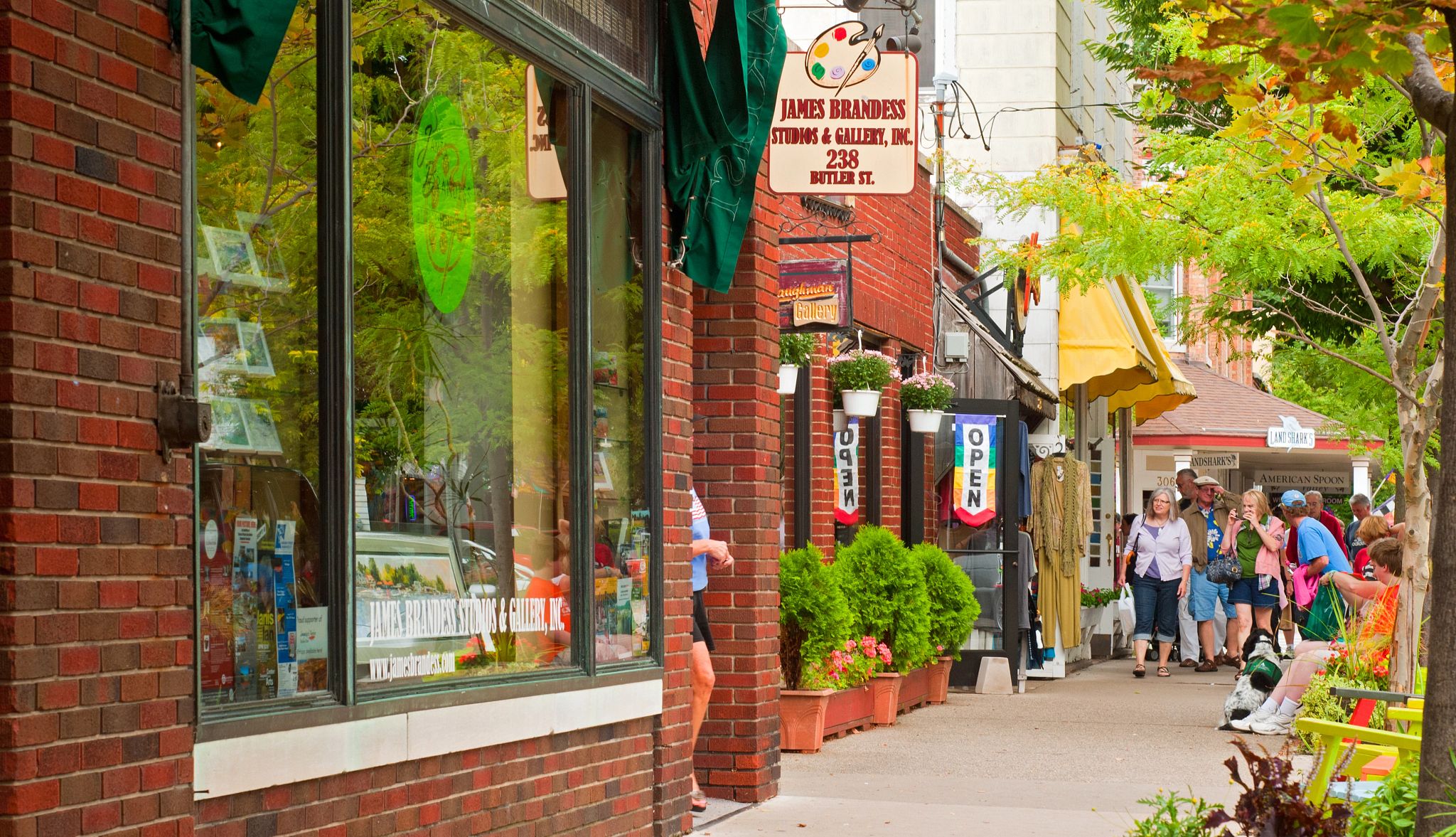 Nostalgic Beach Getaways people walking on a sidewalk near storefronts