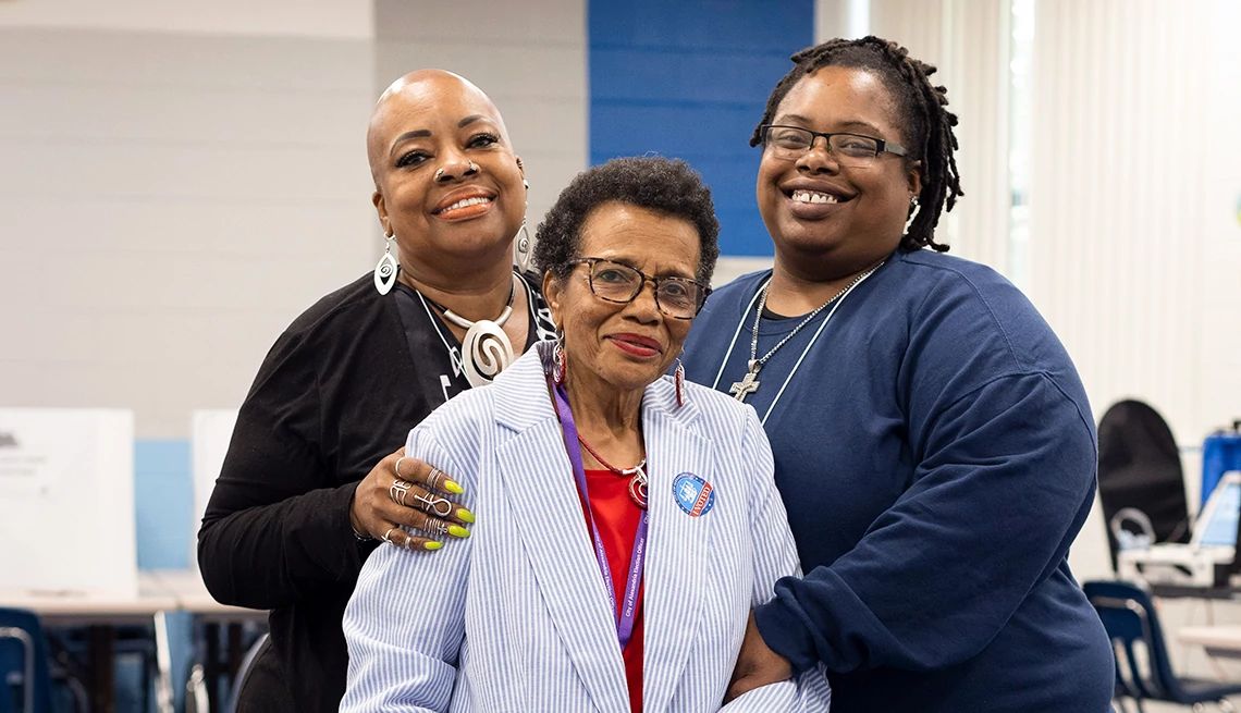 Election Day poll workers rosa byrd, patricia yancey and chanel yancey smile while working togther at a polling site