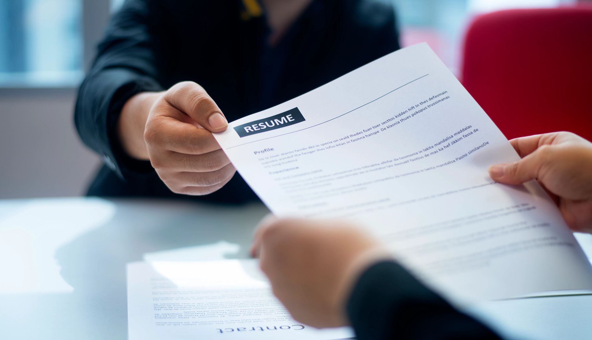 Smart Guide to Getting Hired a person handing someone a resume