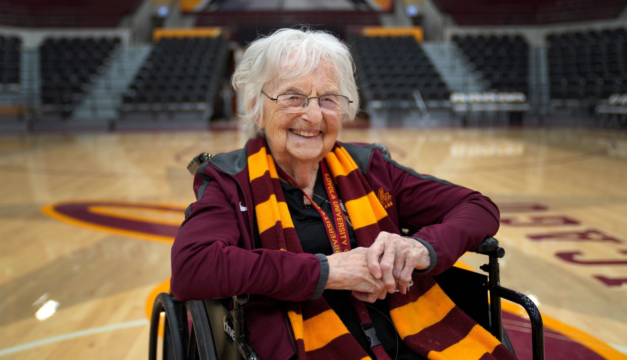 Sister Jean Dolores Schmidt Dies at 106 sister jean smiling for a portrait in loyola colors