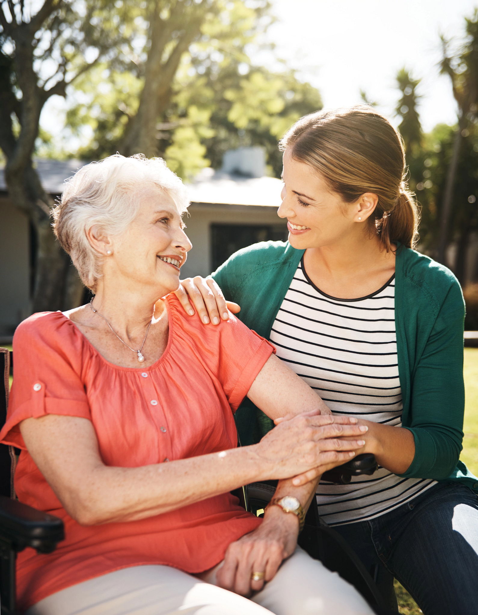 Shot of an elderly woman in a wheelchair spending time with daughter in the garden Shot of an elderly woman in a wheelchair spending time with daughter in the garden