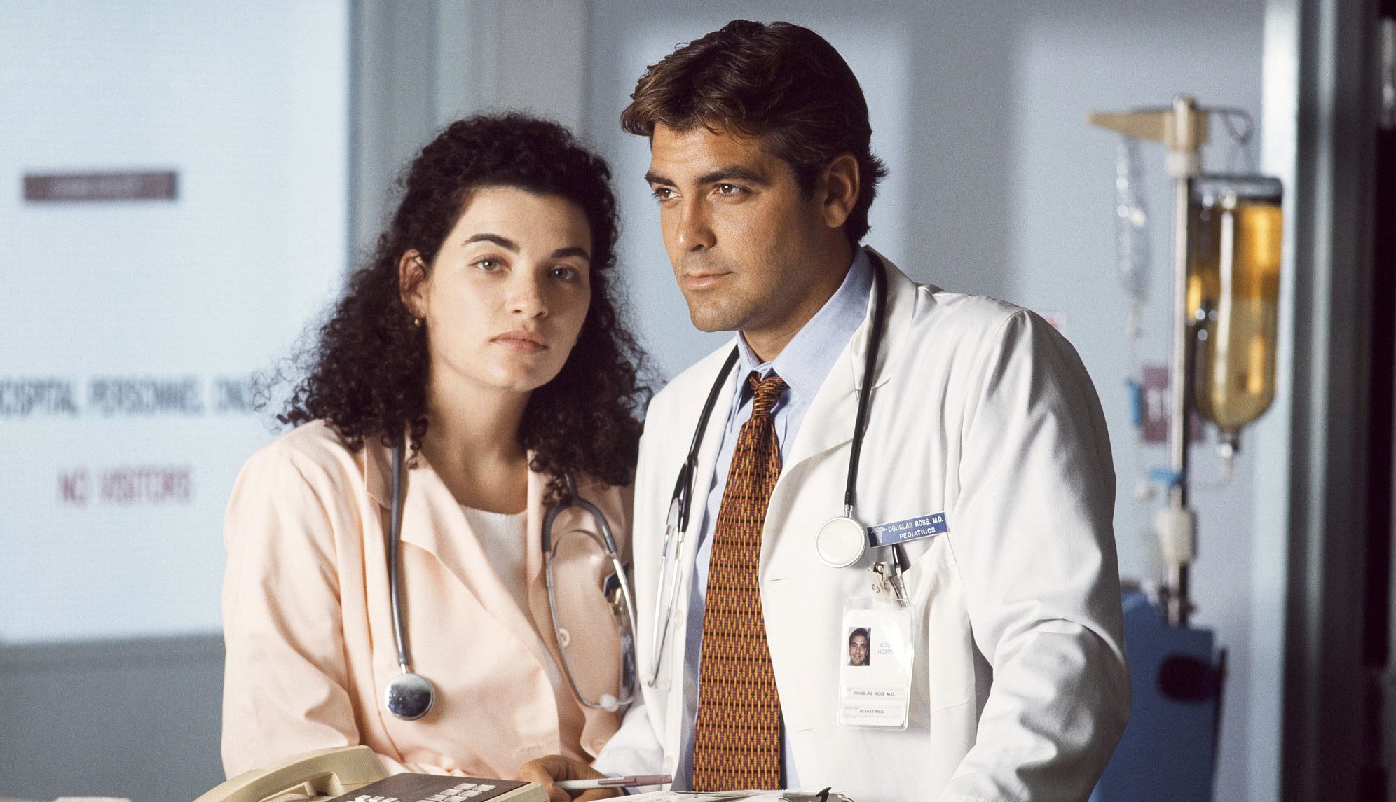 Julianna Margulies starred in 'ER' Young Julianna Margulies as nurse Carol Hathaway with young George Clooney as doctor Doug Ross in a hospital in a still from E R