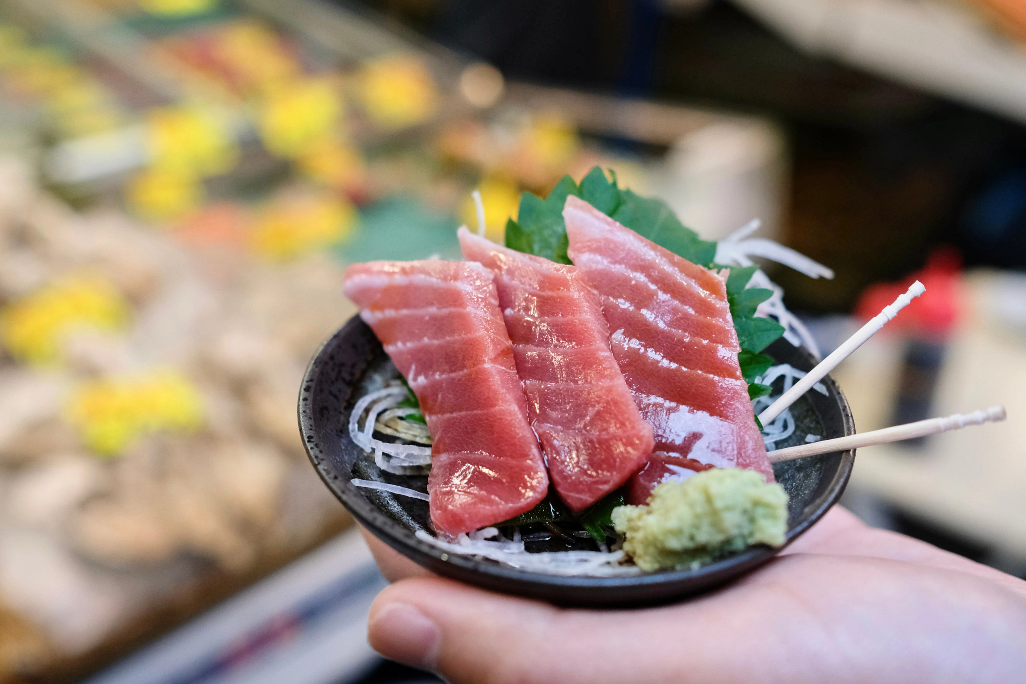 a close up of sashimi slices on a plate