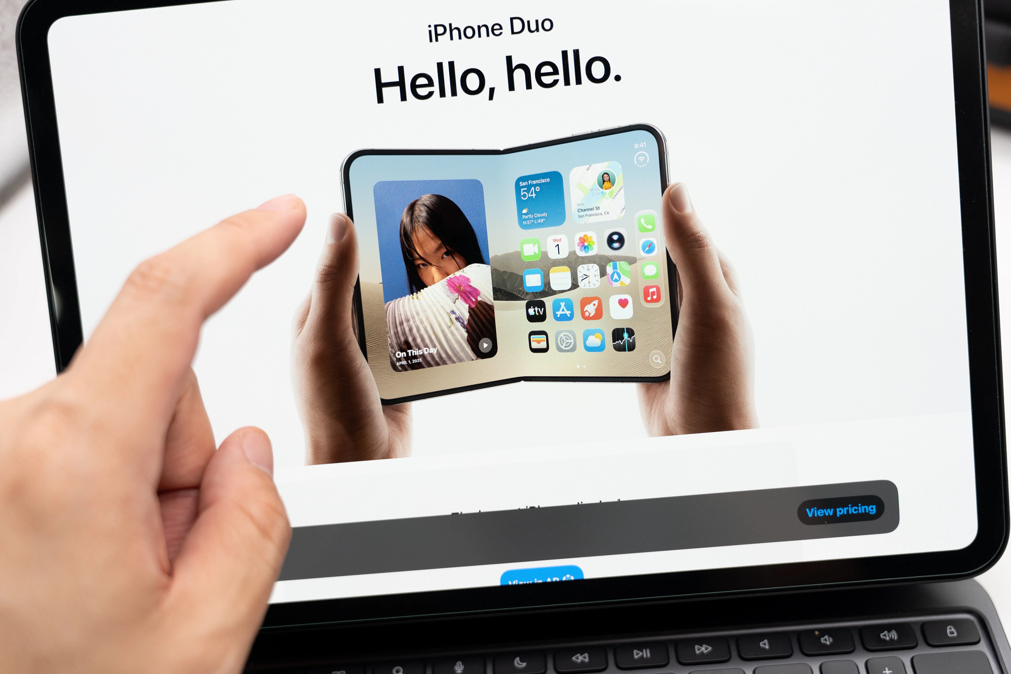 A screen displaying a promotional image for iPhone Duo, showing a foldable smartphone being held in two hands.