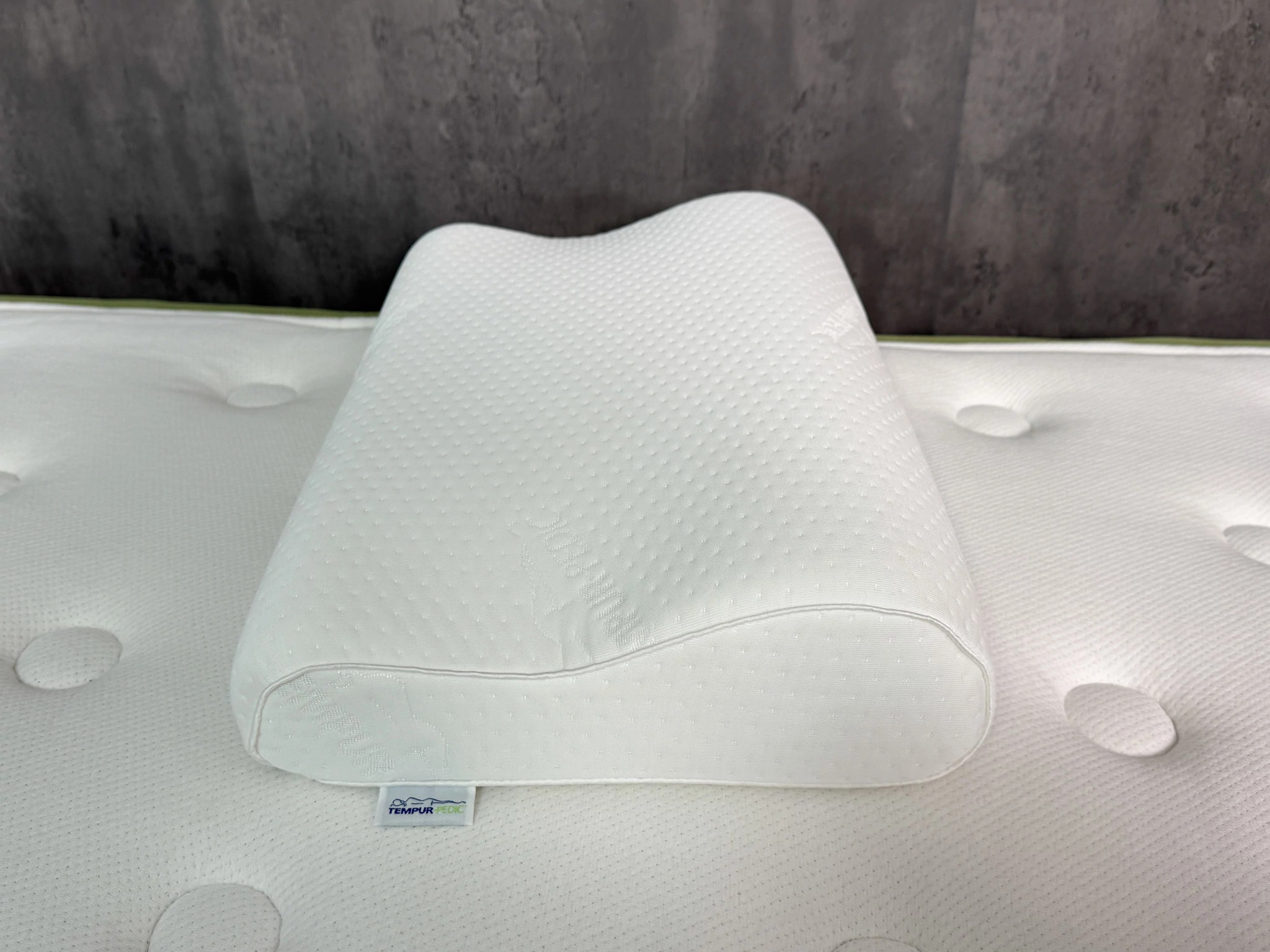 The Tempur-Pedic Tempur-Neck Pillow on mattress