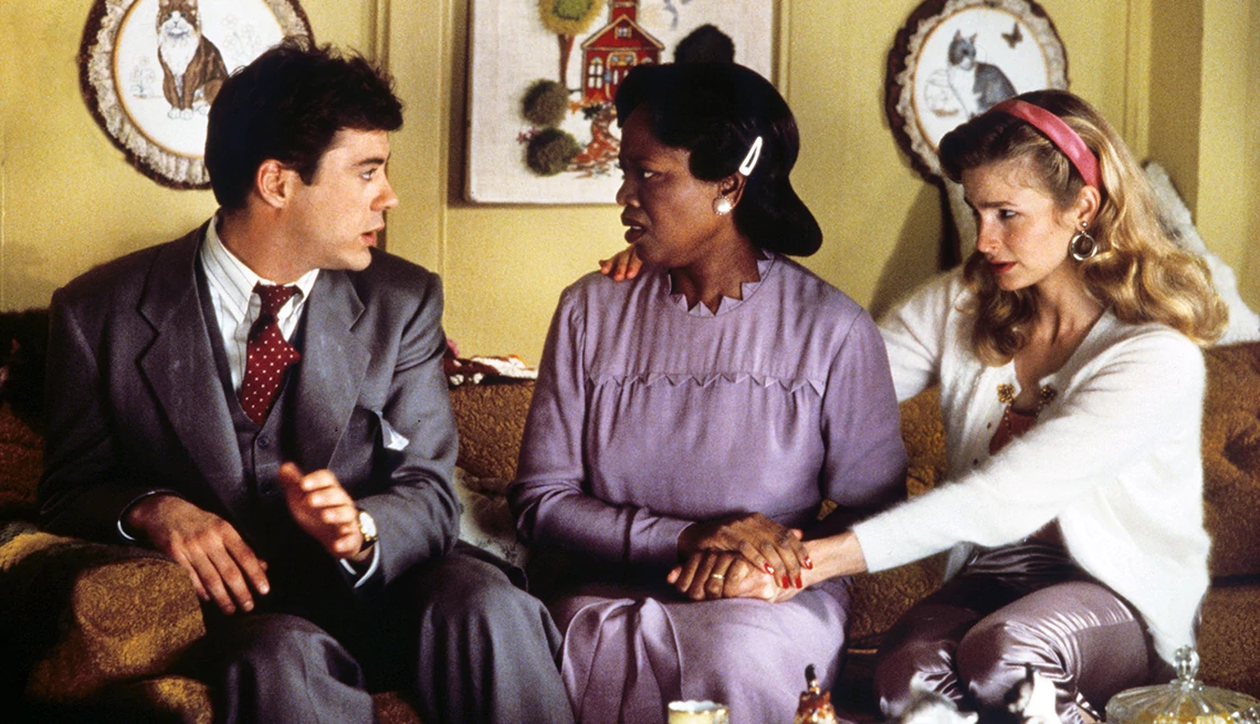 Robert Downey Jr., Alfre Woodard and Kyra Sedgwick sitting together in a scene from the film Heart and Souls