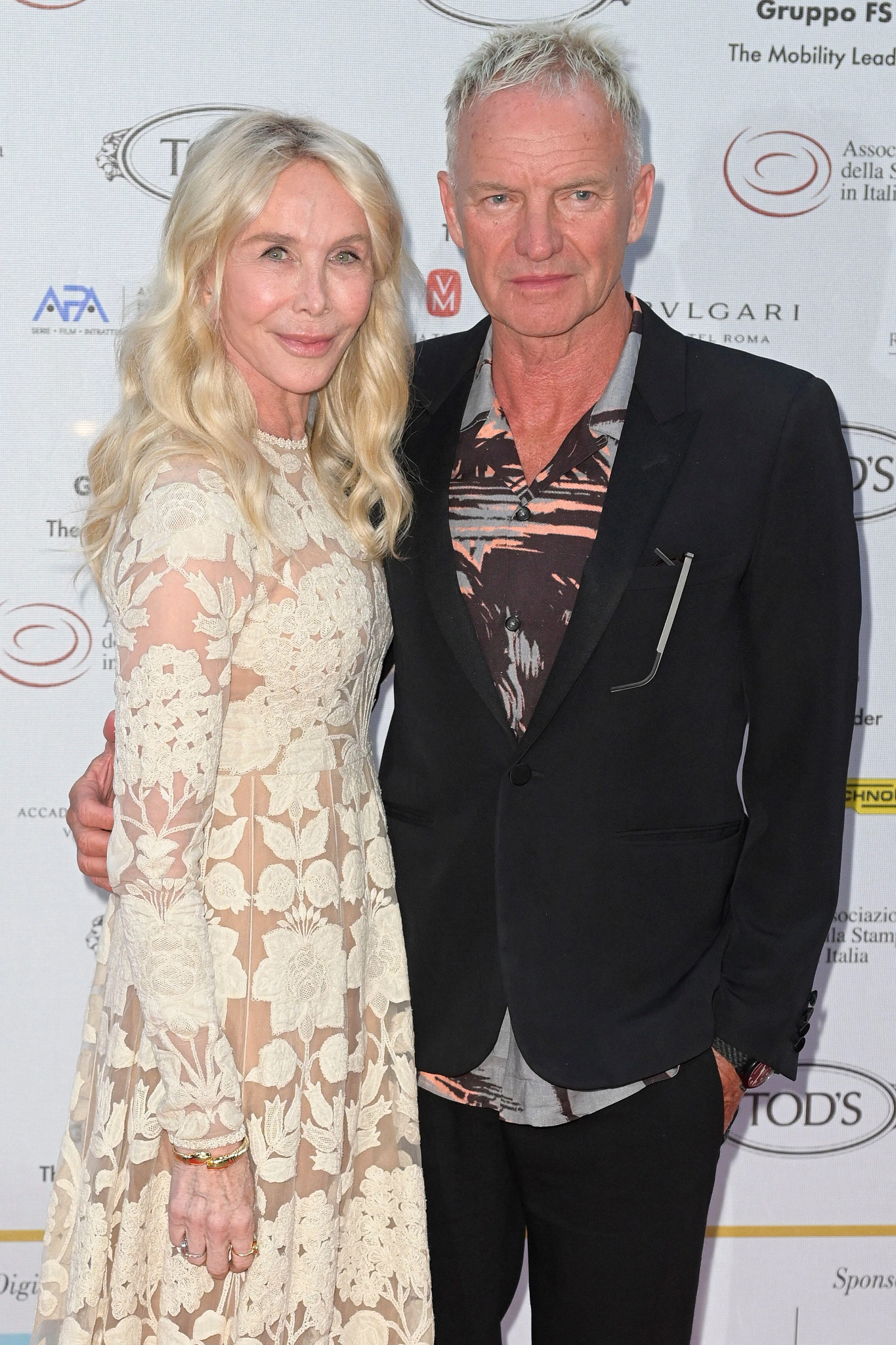 sting and wife trudie styler posing together at a red carpet event