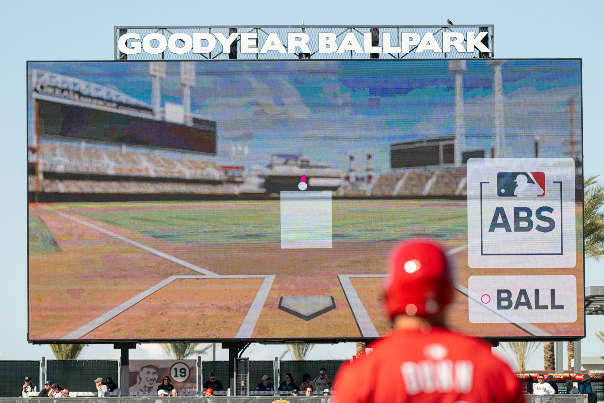 a photo and graphic illustration shows MLB’s automated ball-strike challenge system