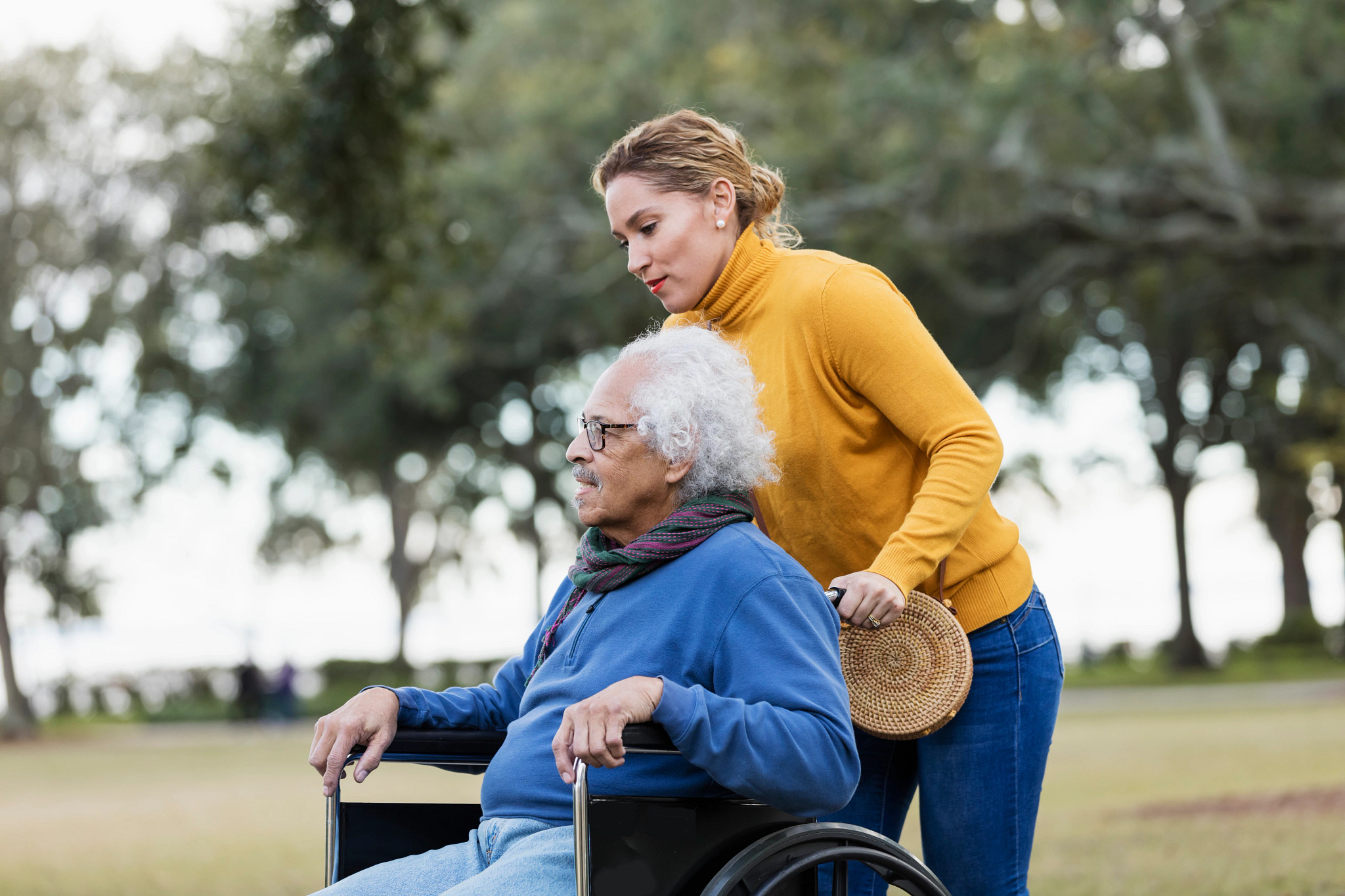 Caregiver pushing wheelchair
