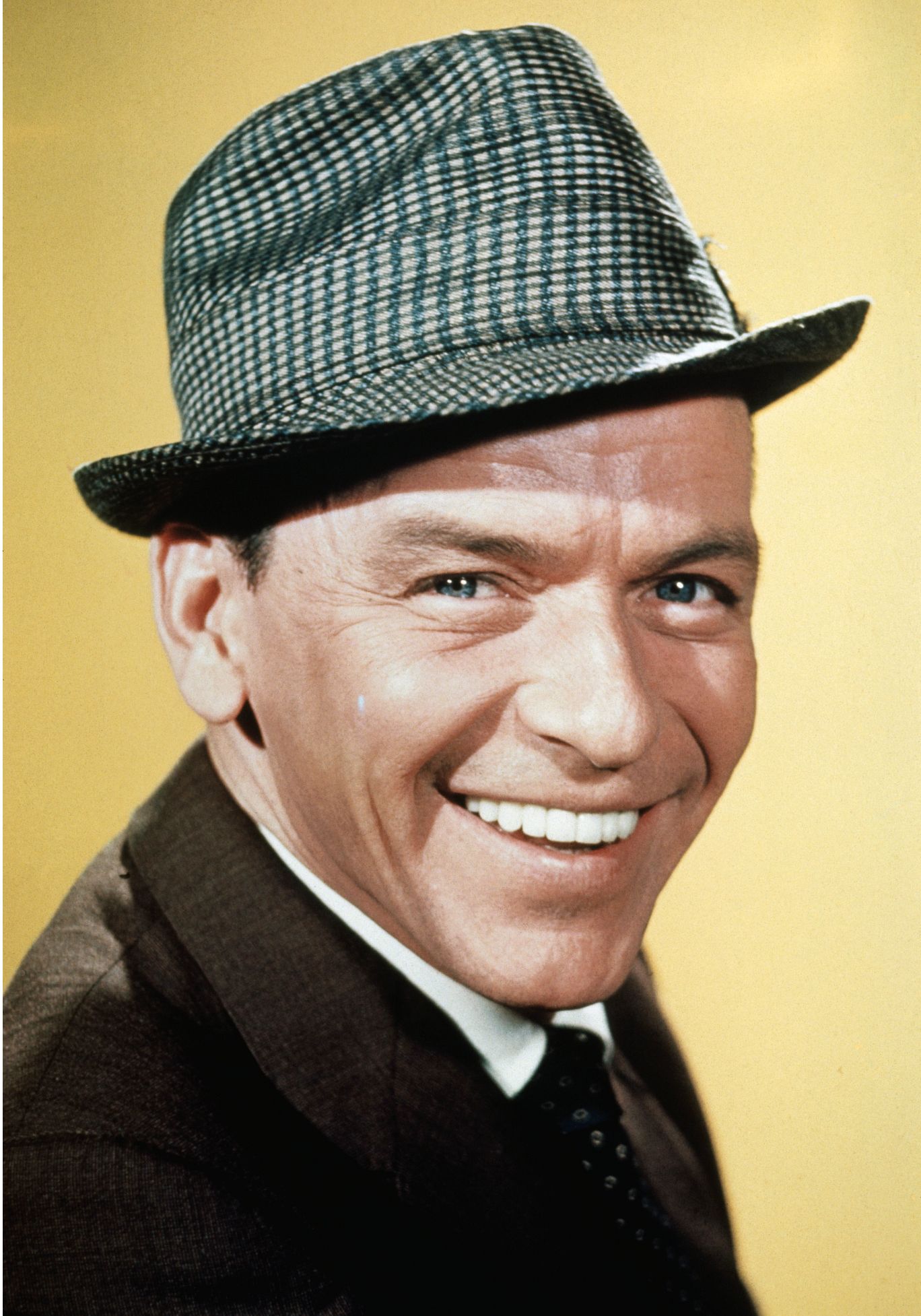 Frank Sinatra Frank Sinatra smiling and wearing a hat