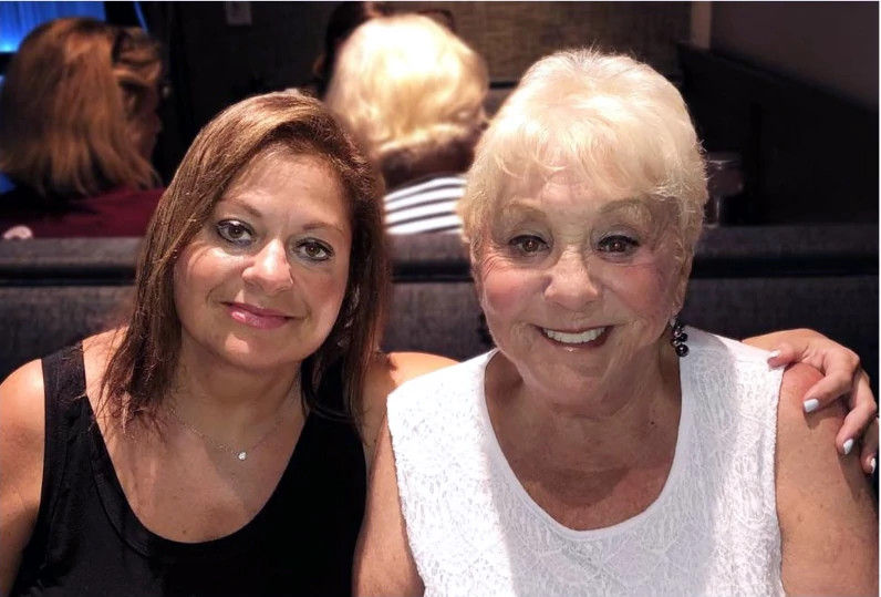 Author Margie Zable Fisher and her mother Rona at a birthday dinner for Fisher's husband in 2019