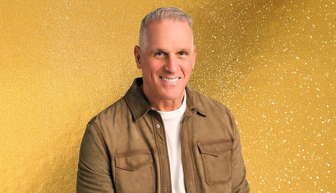 Mel Owens is the New Golden Bachelor mel owens on a glittery gold background