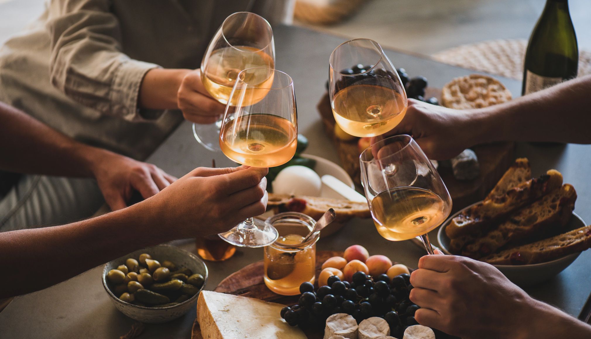 Refresh Your Summer Wine/Food Experience people at a table drinking glasses of wine
