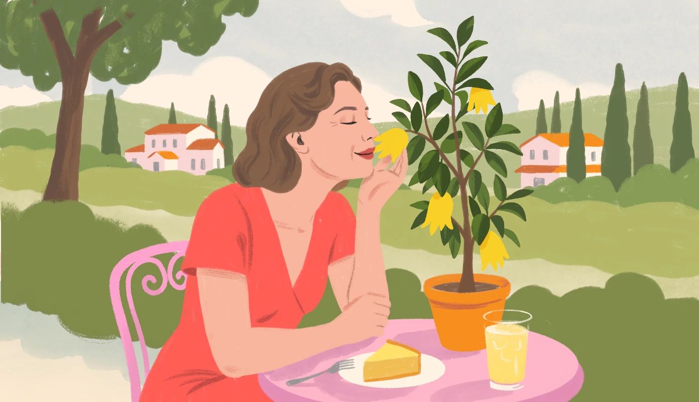 This Plant Saved My Retirement a woman sits outside, smelling a yellow and green plant