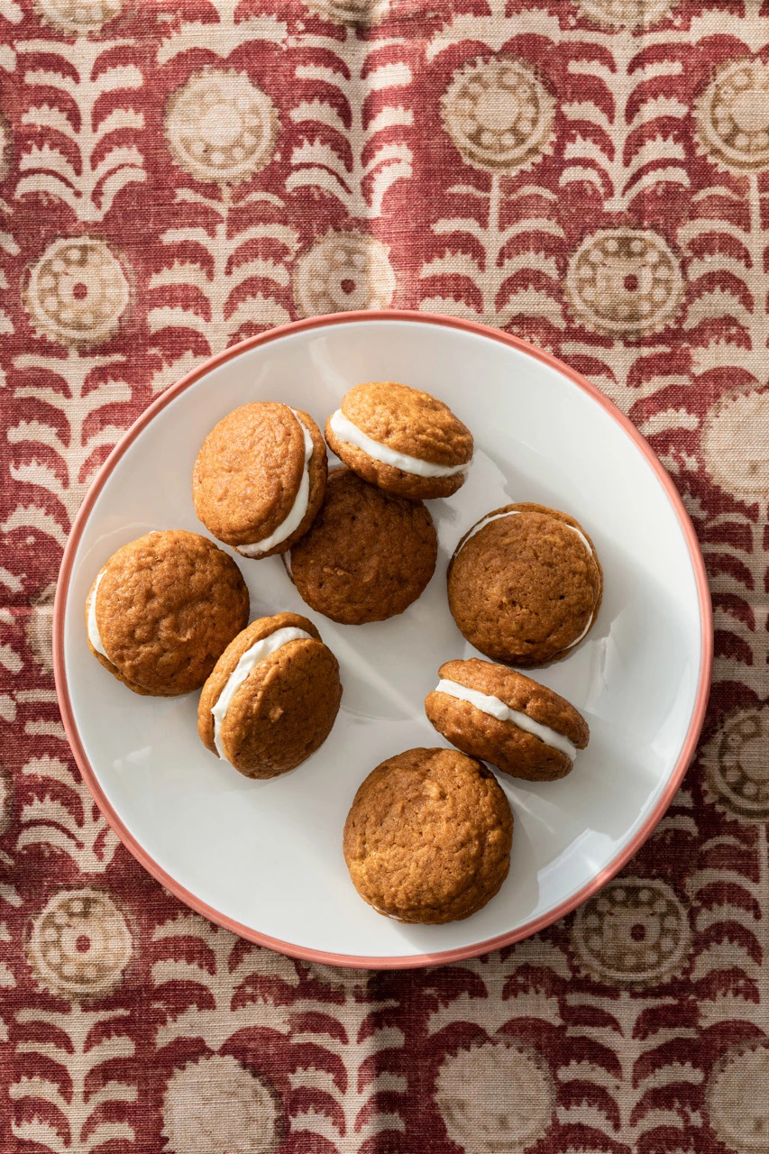 Mini pumpkin whoopie pies presented on a plate
