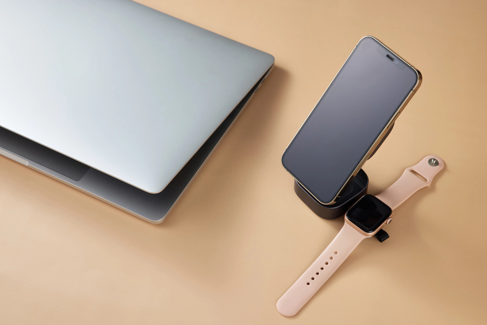 a smartphone, smart watch and a laptop