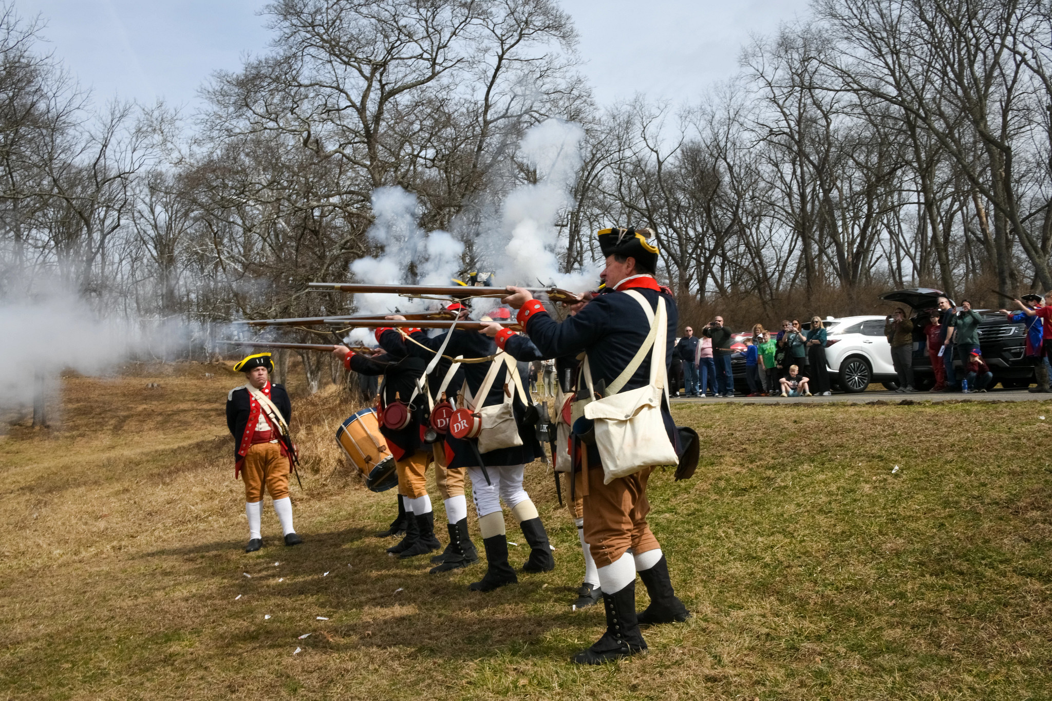 Revolutionary War reenactors firing guns