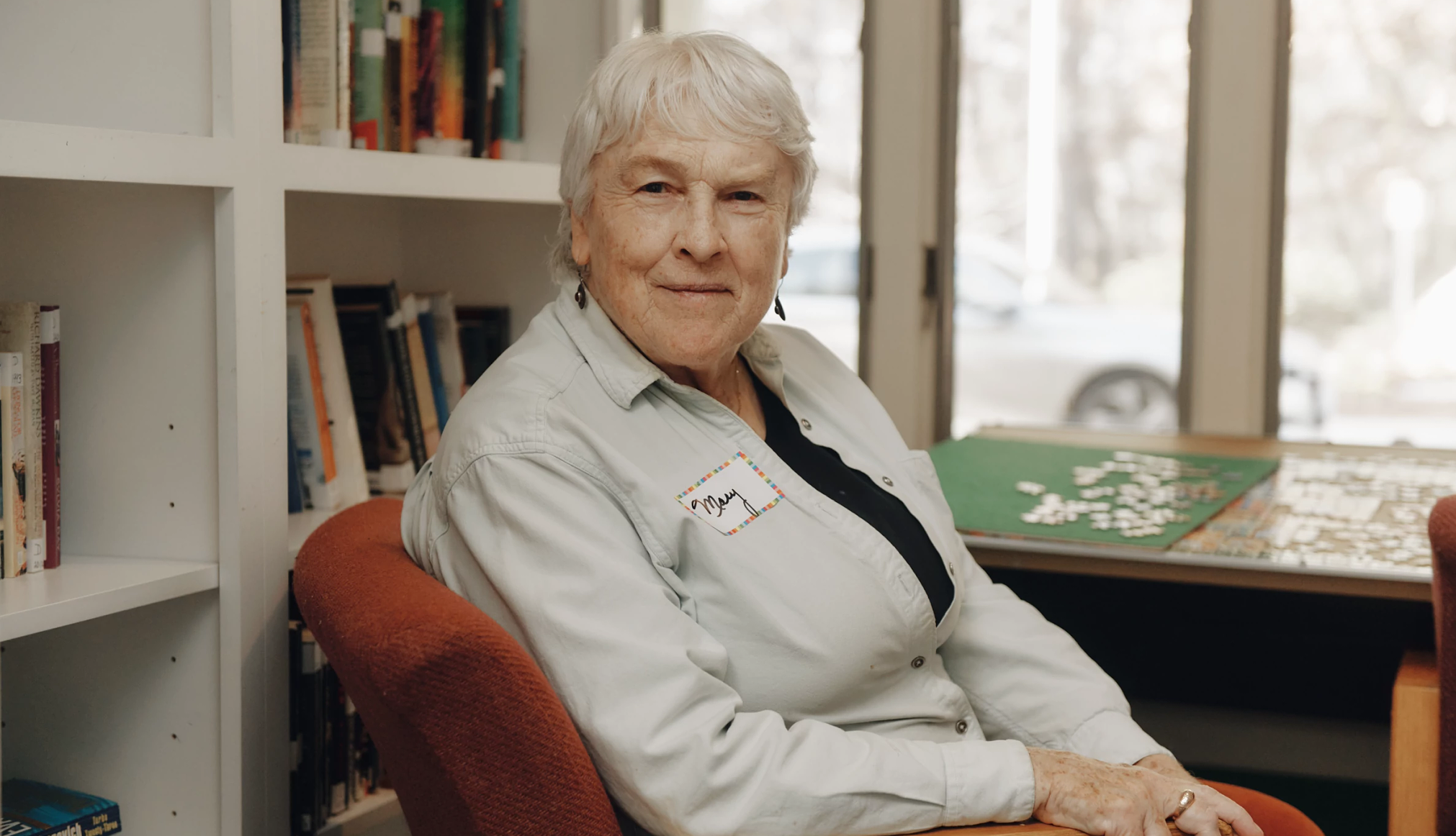 LGBTQ+ Older Adults Find Safe Spaces at Senior Centers a person sitting in a chair