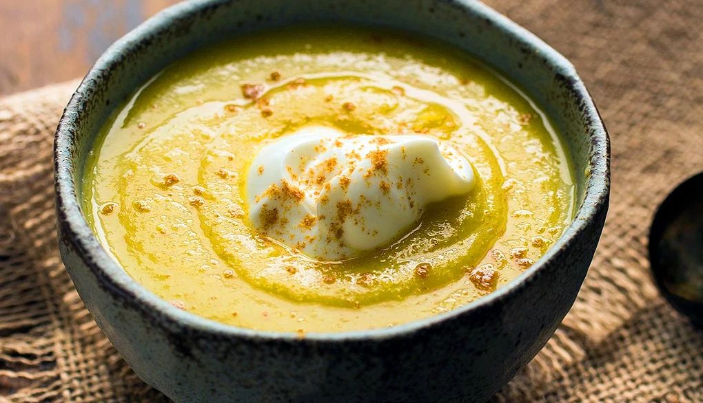 Curried parsnip and apple soup A close-up view of curried parsnip and apple soup in a bowl