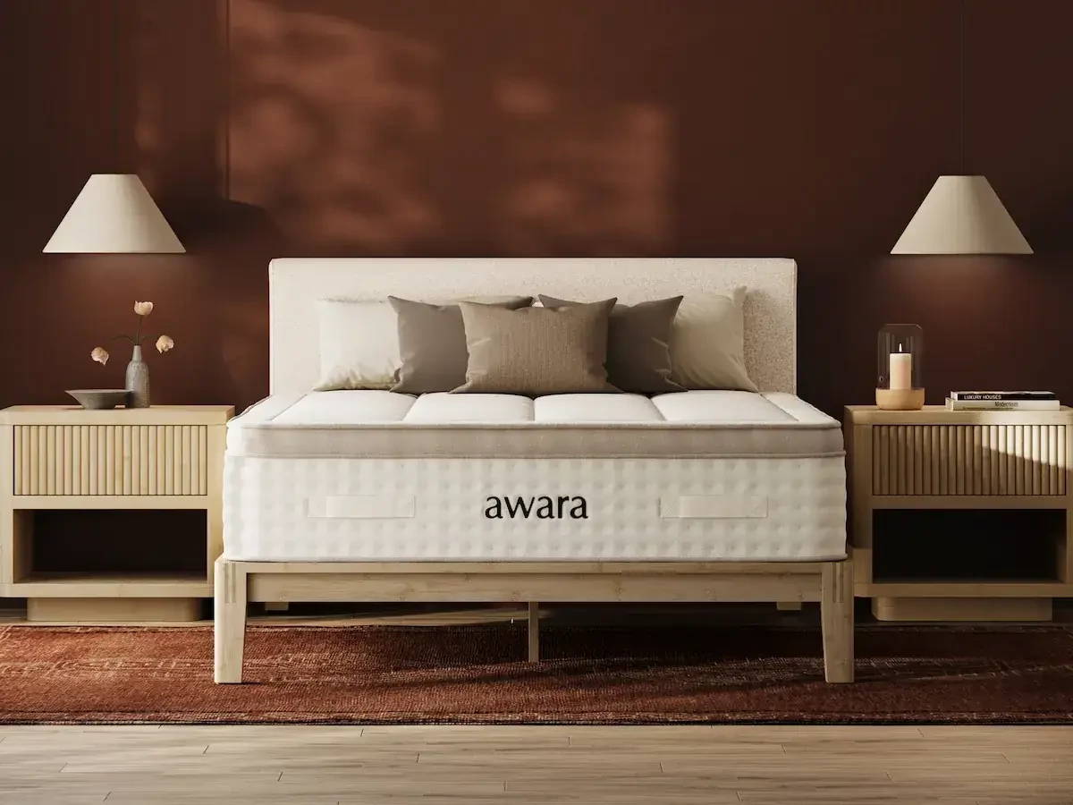 The Awara Premier Hybrid mattress displayed in a bedroom with brown walls