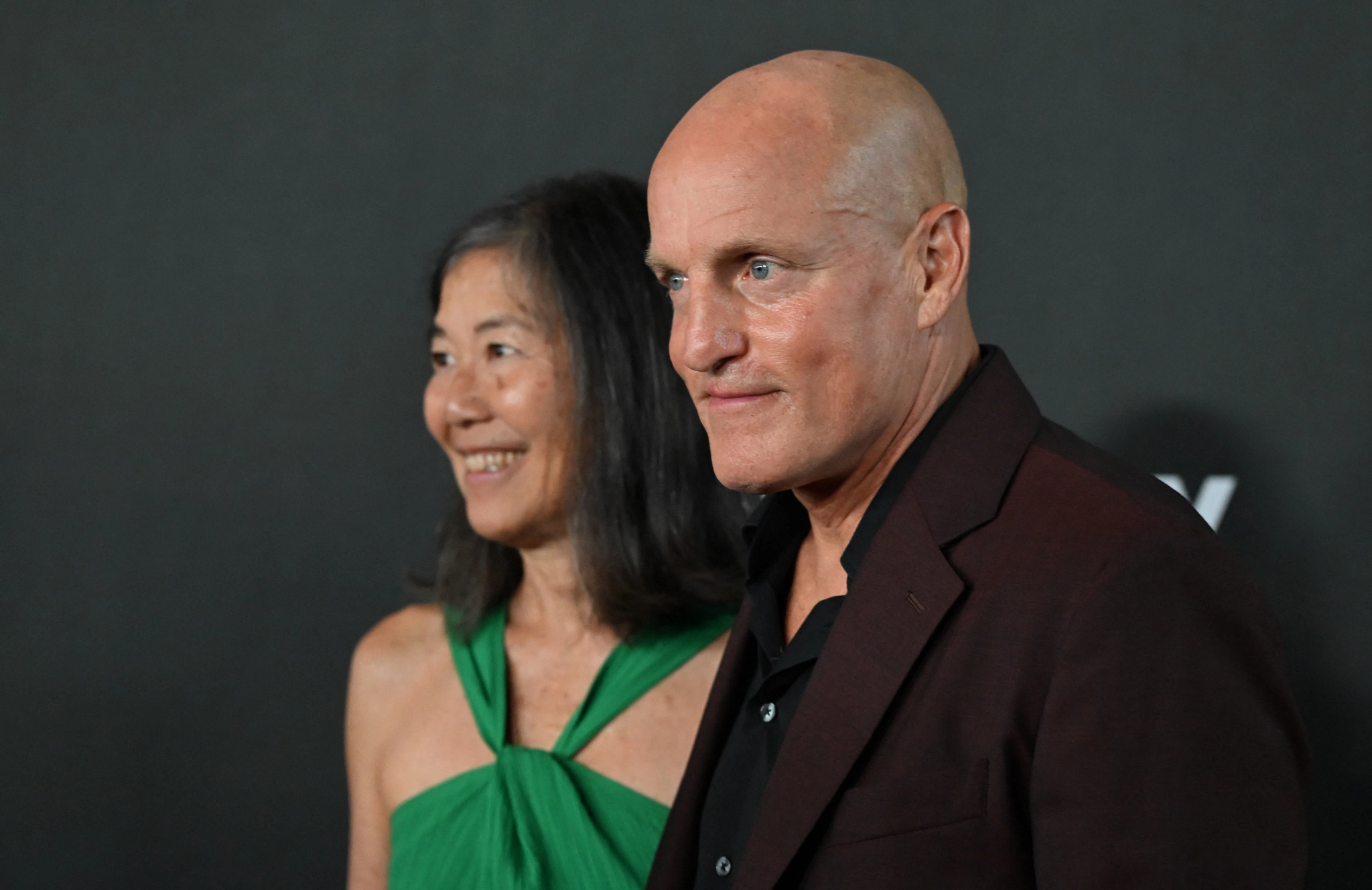 woody harrelson and laura louie smiling at the mark twain prize award ceremony