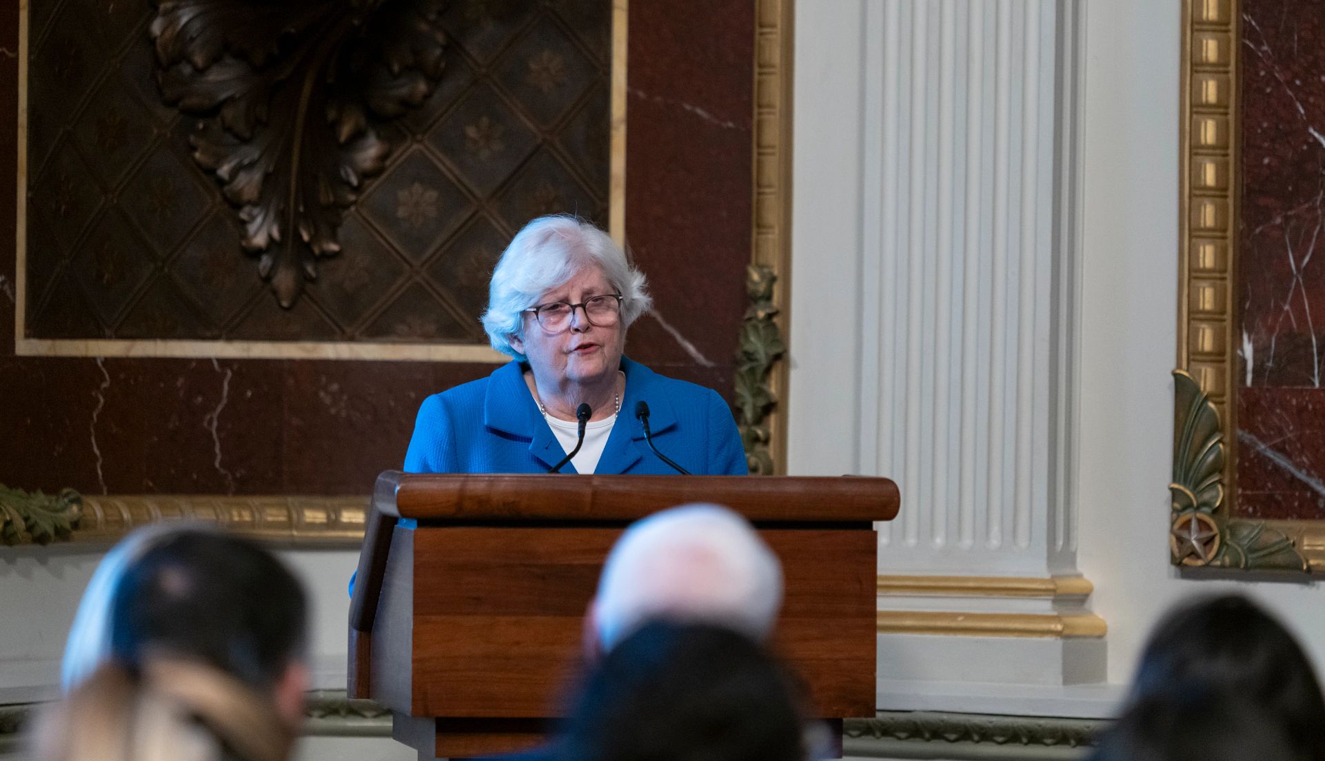 AARP backs new rules for financial advisers nancy leamond speaks from a podium