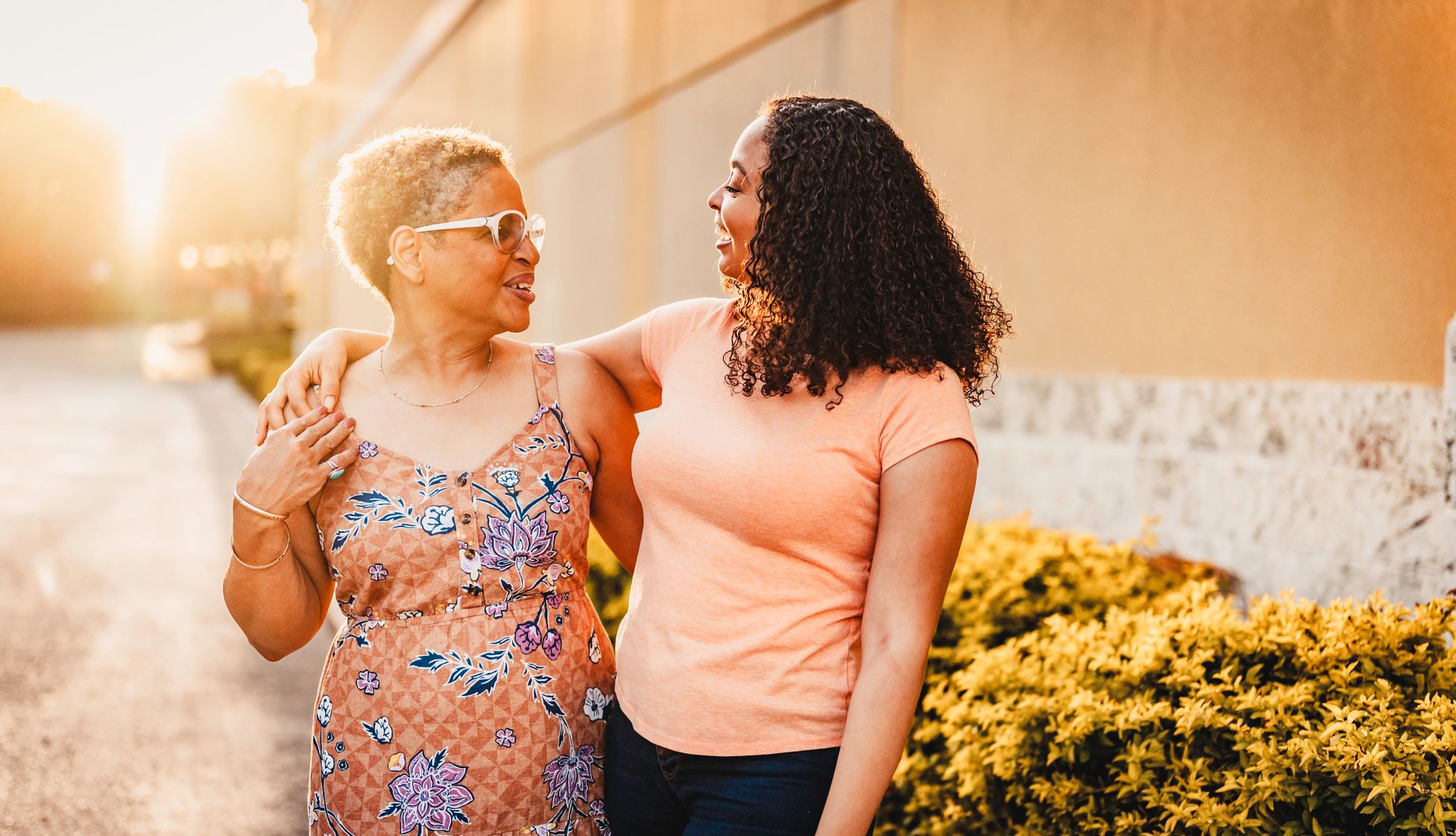 Talk to your family about a health care surrogate An adult woman puts her arm around her smiling mother as they stand outside