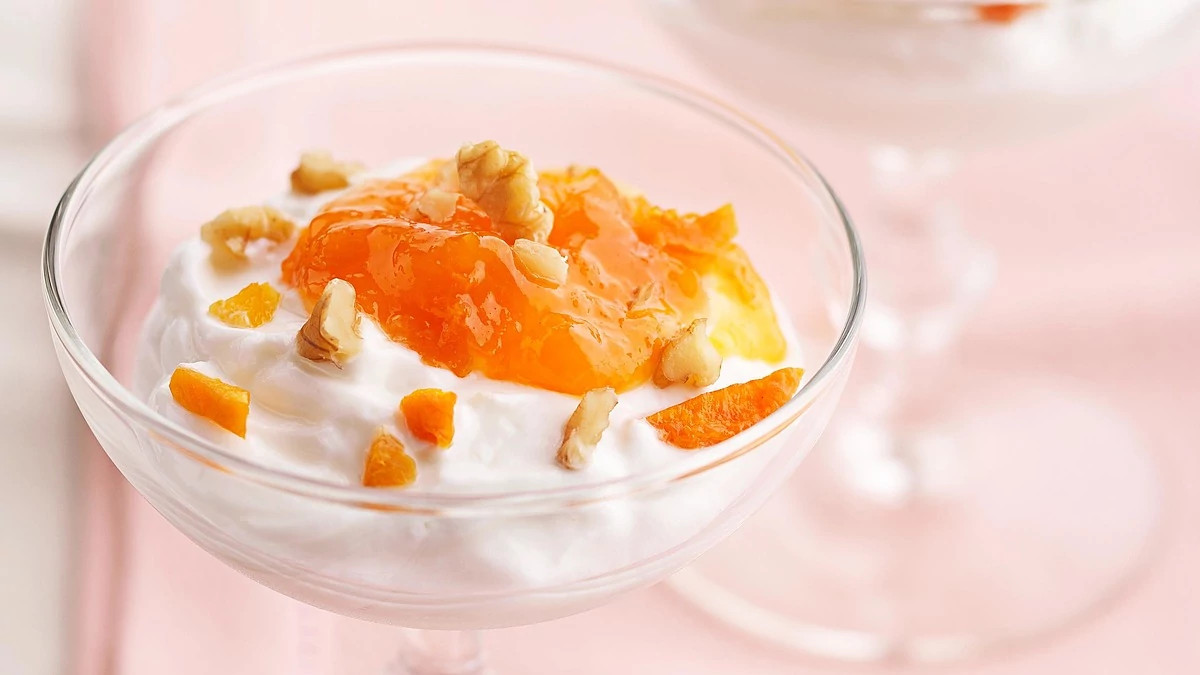 A close-up view of apricot yogurt delight in a glass