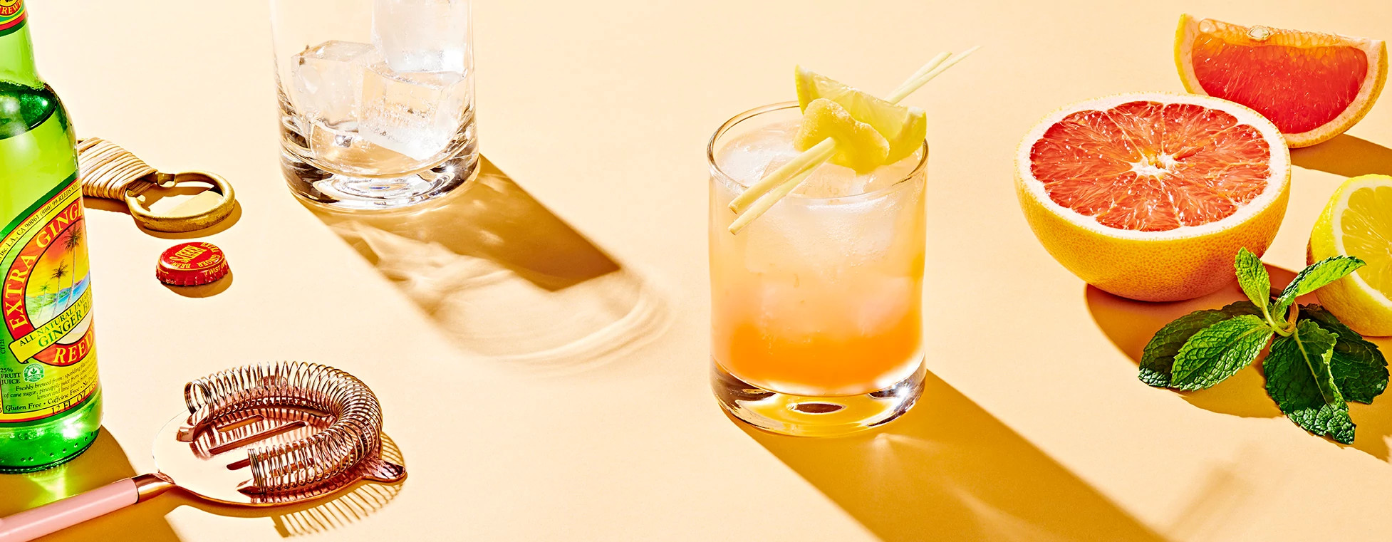 mocktail surround by grapefruit and mixer