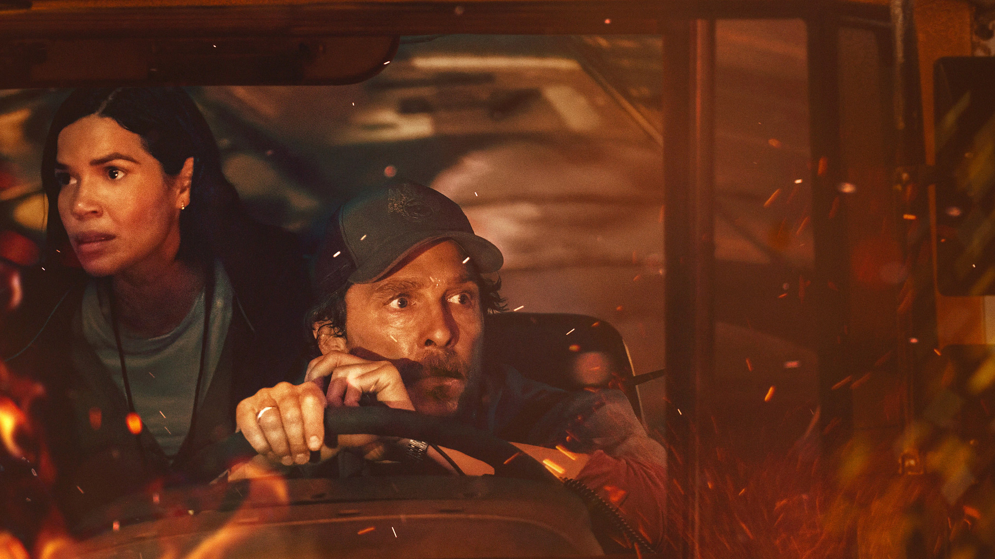 matthew mcconaughey behind the wheel of a school bus in a scene from the lost bus