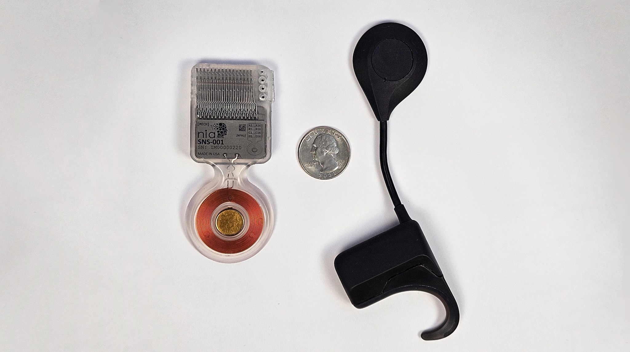 A cranial implant device by Nia Therapeutics and the exterior earpiece.