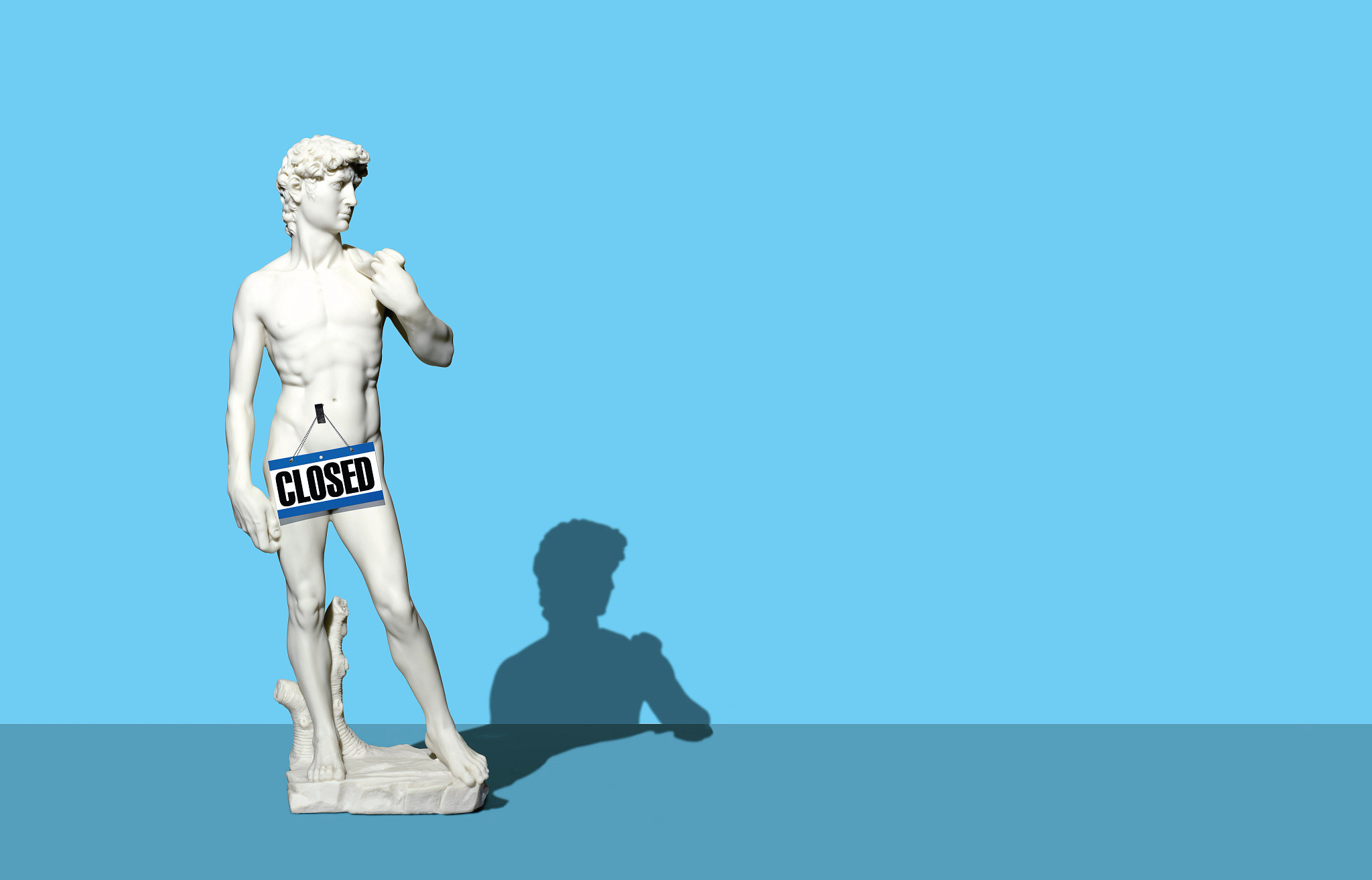 statue of david with closed sign