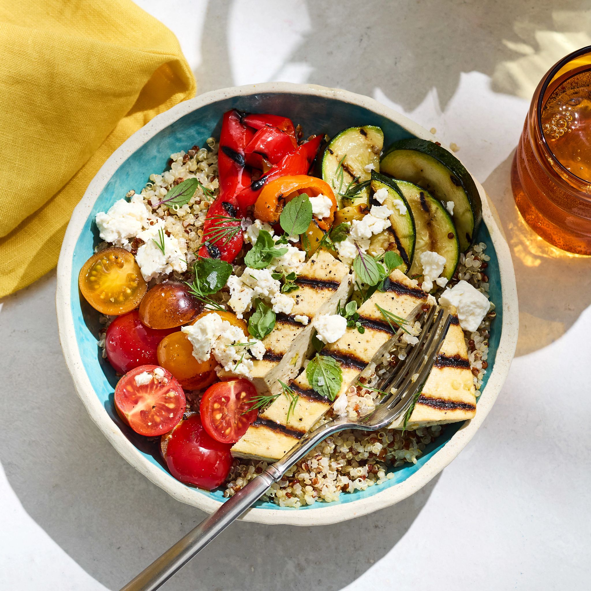 Farmers Market Menu grilled vegetable grain bowl with citrus vinaigrette and feta is pictured