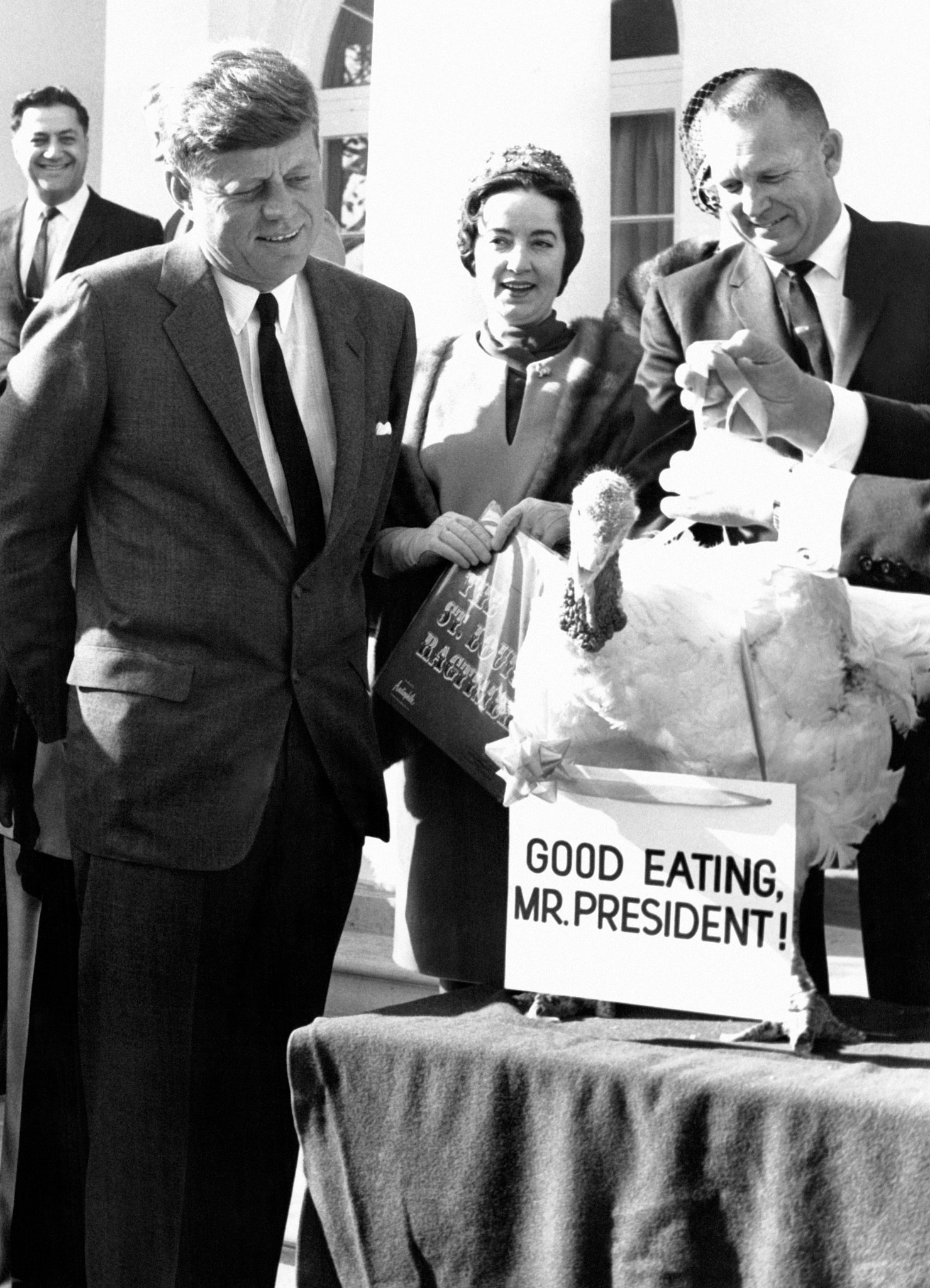 president john f kennedy looks at a turkey 