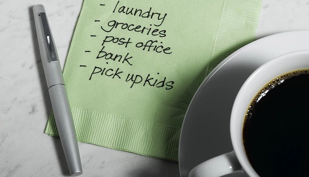 To-do lists can be helpful for reminders A close-up view of a cup of coffee and a to-do list on a napkin
