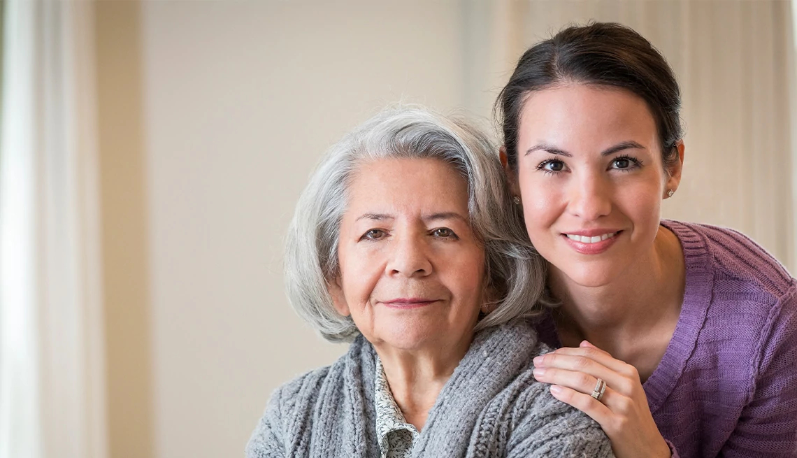 Adult daughter hugging her mother