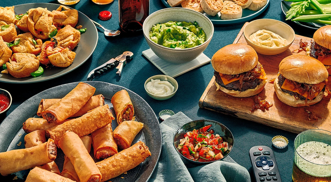 Super Bowl recipes styled on colorful surface