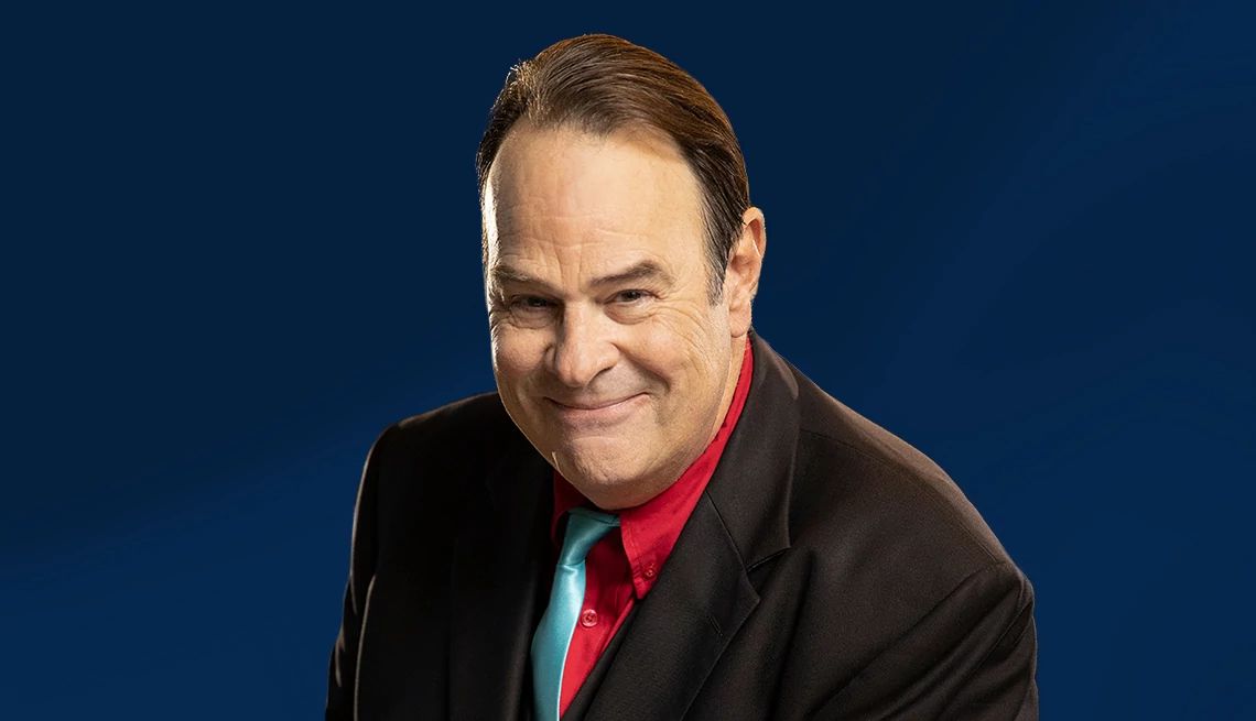 Dan Aykroyd interview Dan Aykroyd against dark blue ombre background